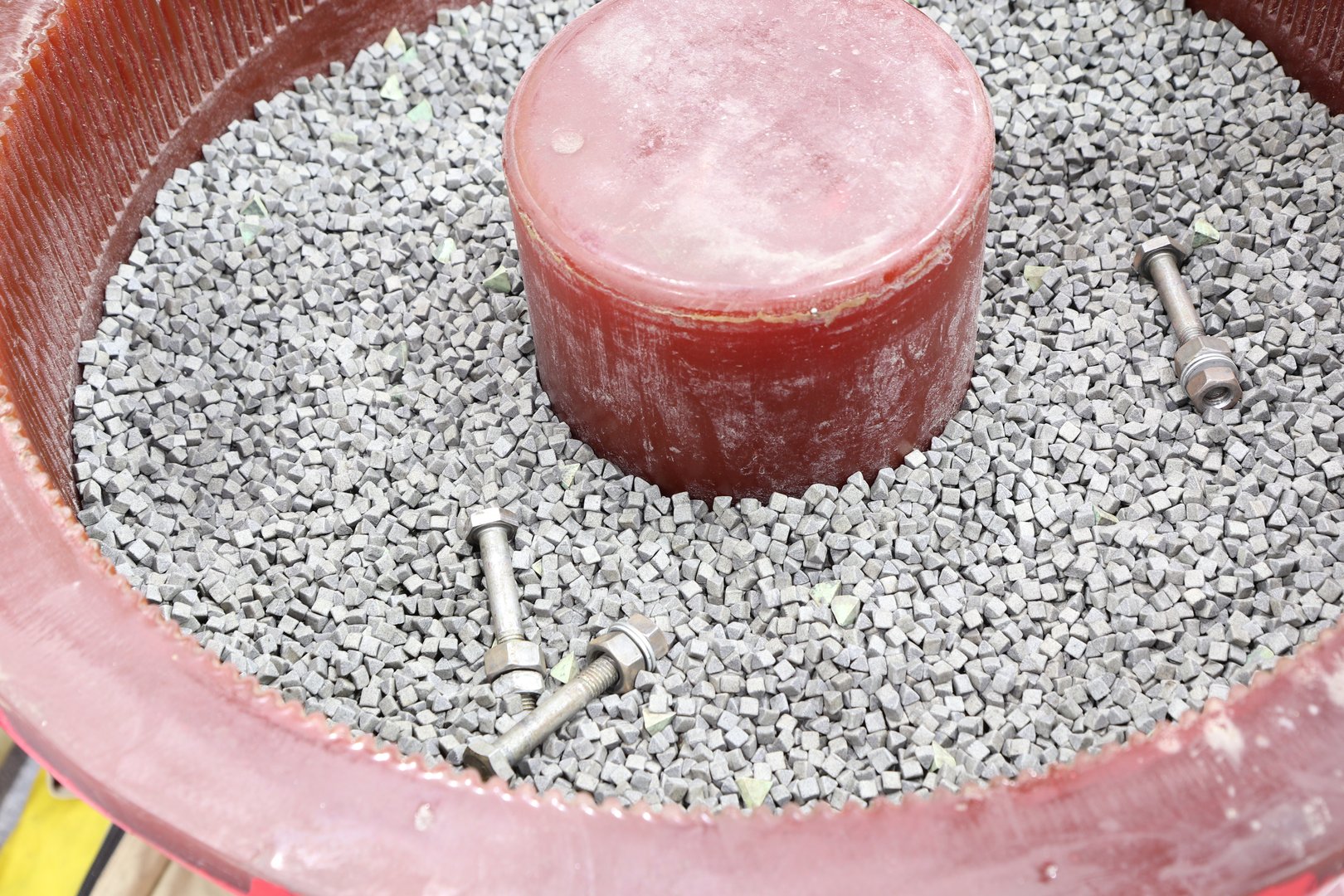 The barrel finishing  machine :Abrasive media, work pieces, compound and water are loaded into barrels at a certain ratio and are put into motion in tank.