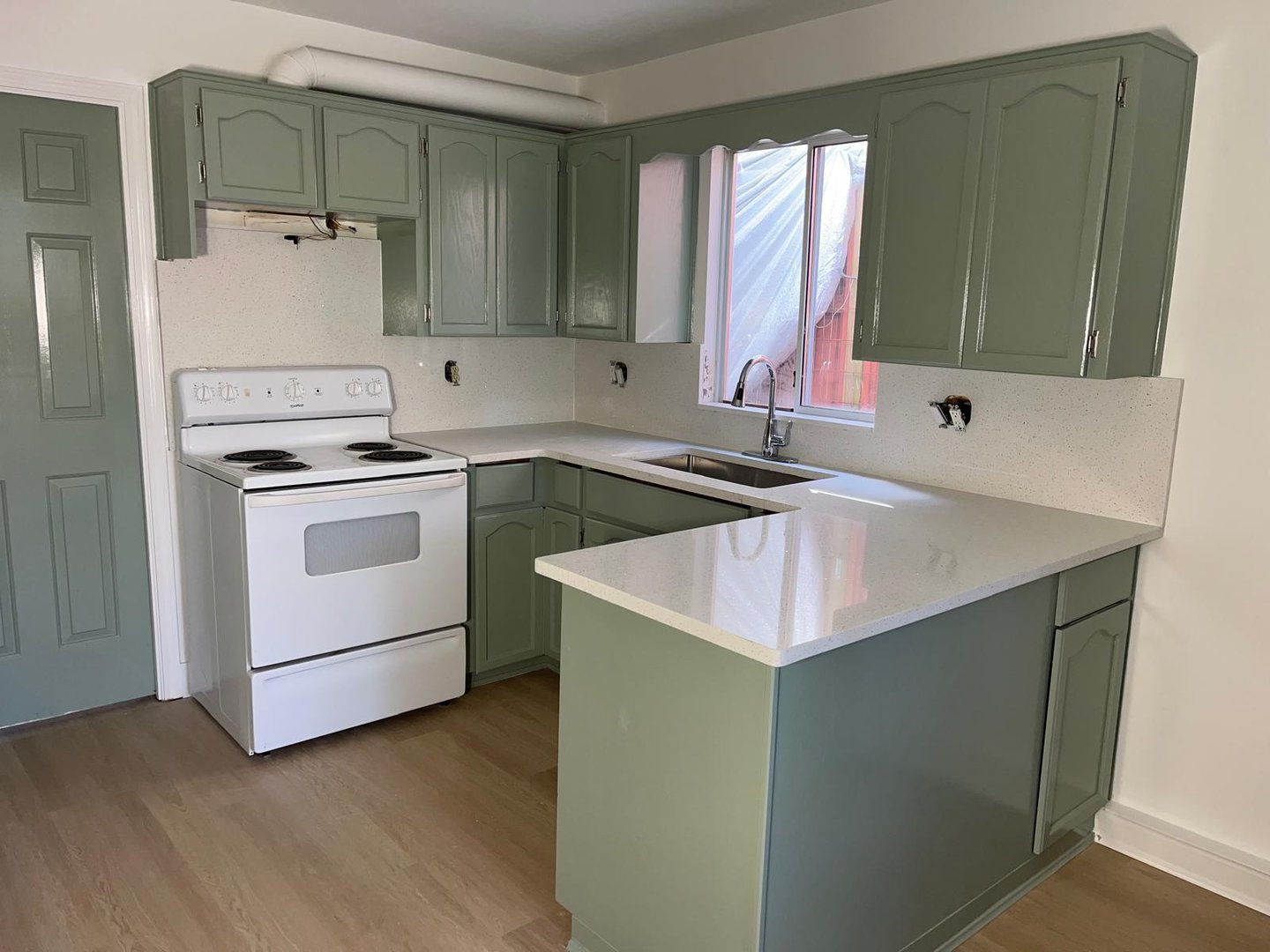 After - Kitchen cabinets after refinishing