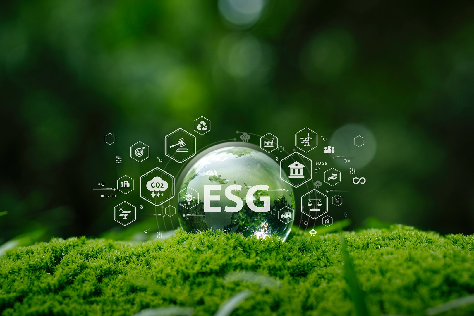 ESG sustainability concept for environmental, social, and governance in sustainable and ethical business. glass globe on green moss and eco icons for climate action, carbon reduction, renewable energy