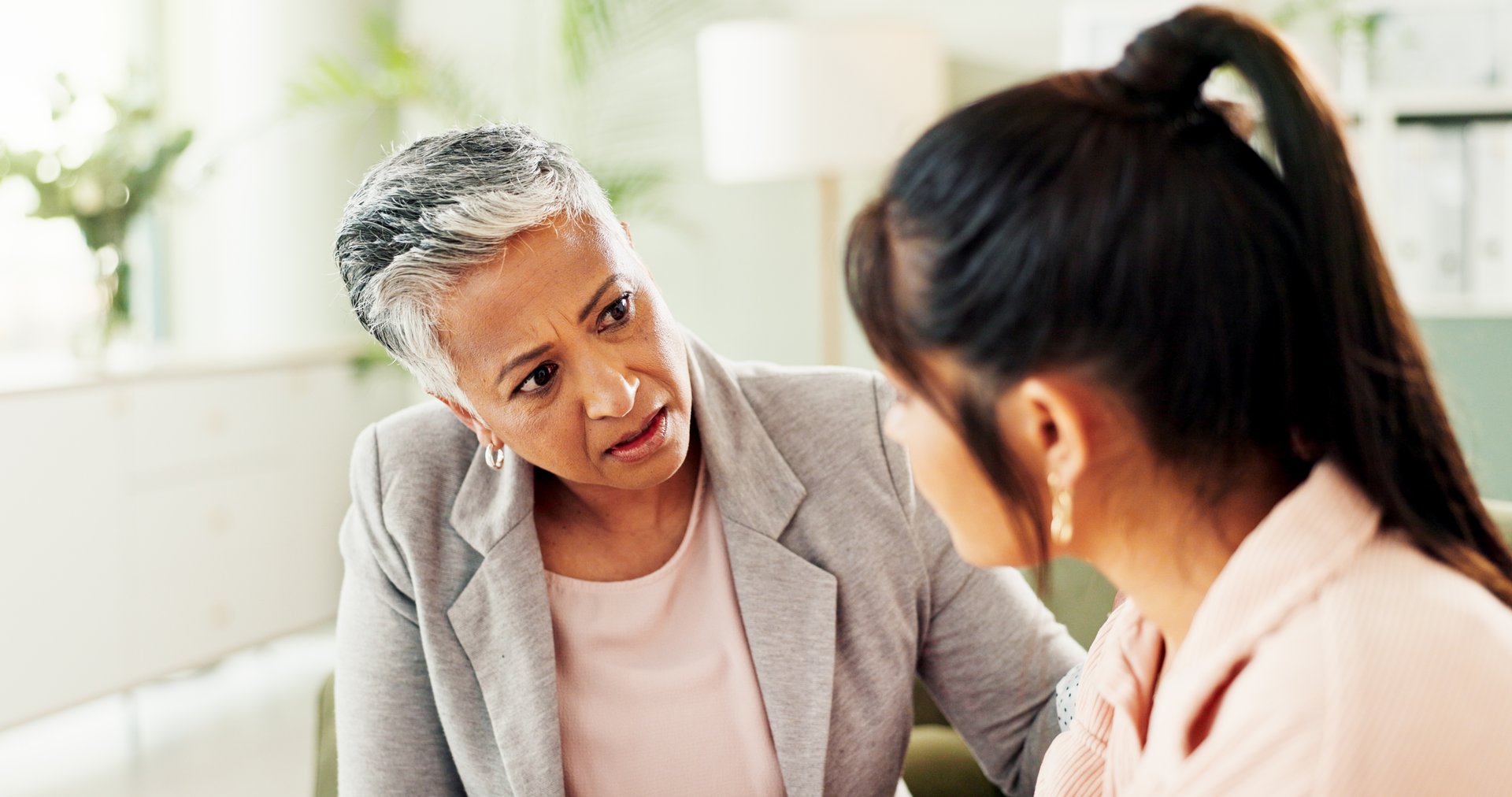 Sad, counseling and help with women at therapist office for mental health, depression and empathy. Psychologist, grief recovery and trauma with people  in clinic for support, compassion and therapy