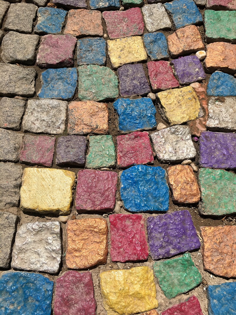 Colorful cobblestones in near plan.
