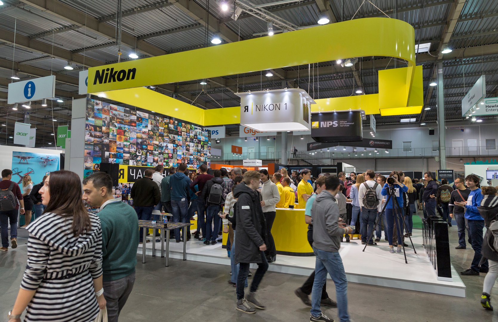 Kiev, Ukraine - October 9, 2016: Unrecognized visitors testing professional photographic cameras on Nikon booth during CEE 2016.
