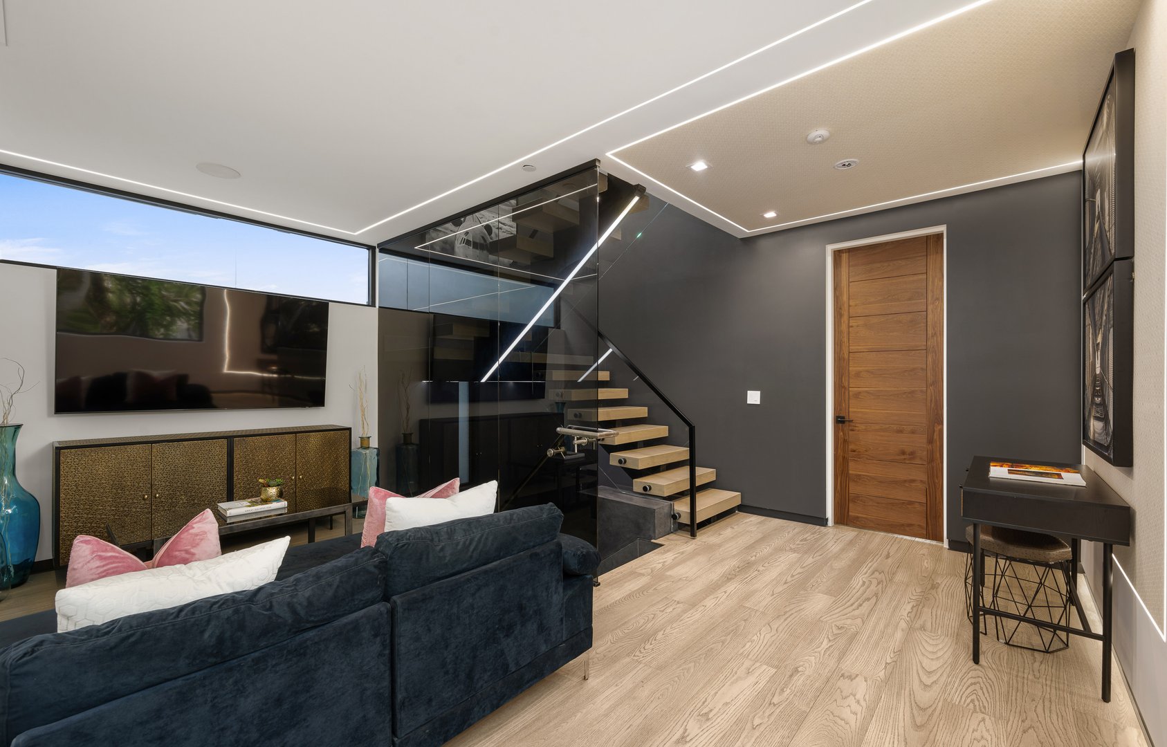 A spacious, well-lit living room with a clean, inviting atmosphere