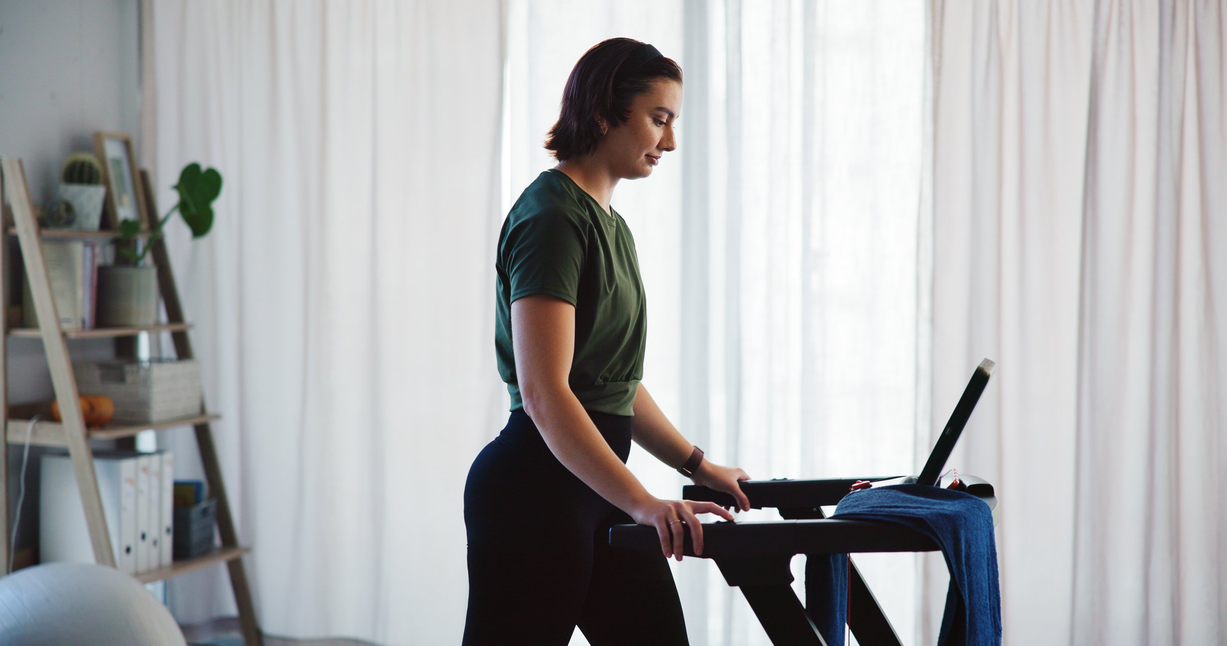 Home, athlete woman or walking on treadmill in for fitness challenge, cardio exercise or health. Mobility, person and electric workout machine for morning routine, weight loss or wellness training