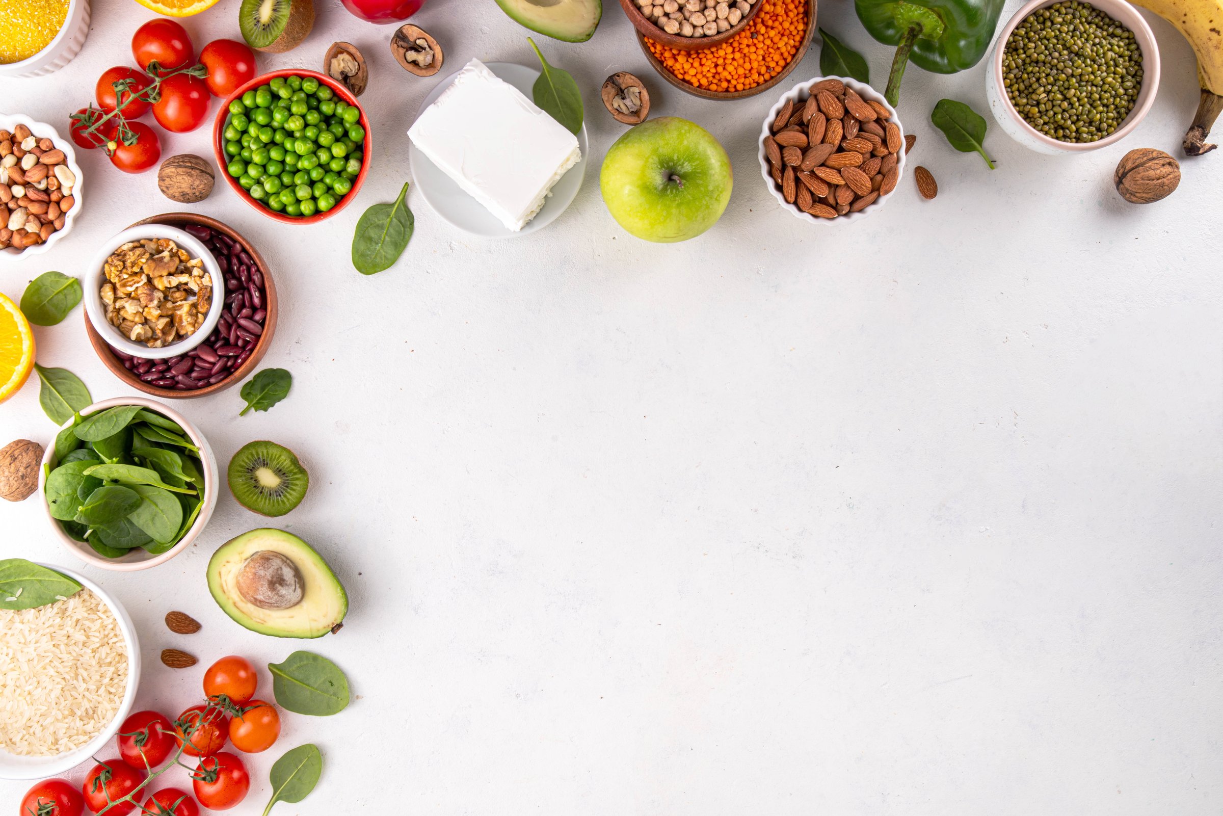 Portfolio Diet, balanced lowering cholesterol vegan food, including nuts, vegetable protein, plant sterols, viscous fiber, beans, legumes, fresh vegetables and fruits on white background copy space