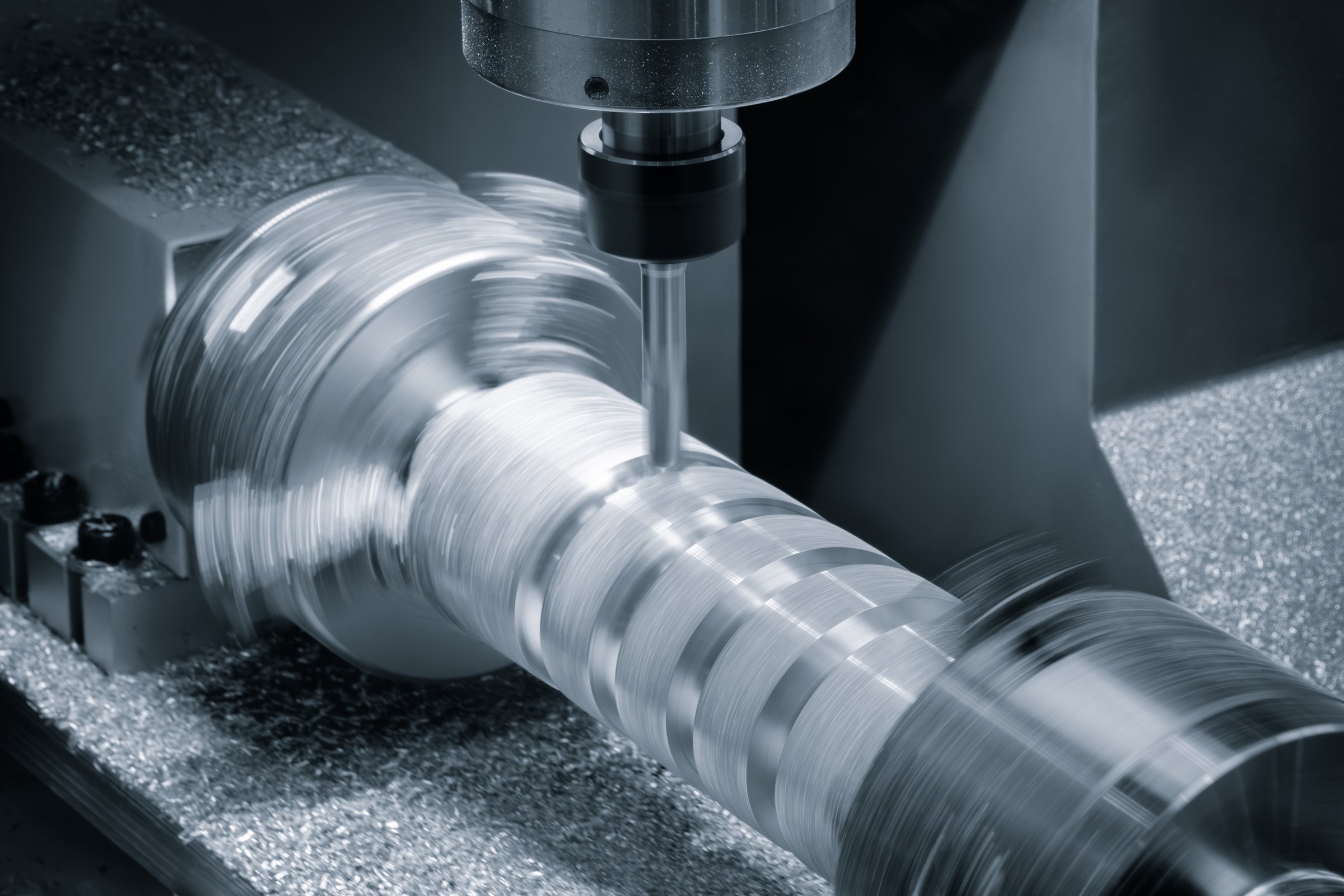 CNC Hi-precision rotation milling machine with cutting sample in blue-silver tone. micro cutting technique in precision part blue tone