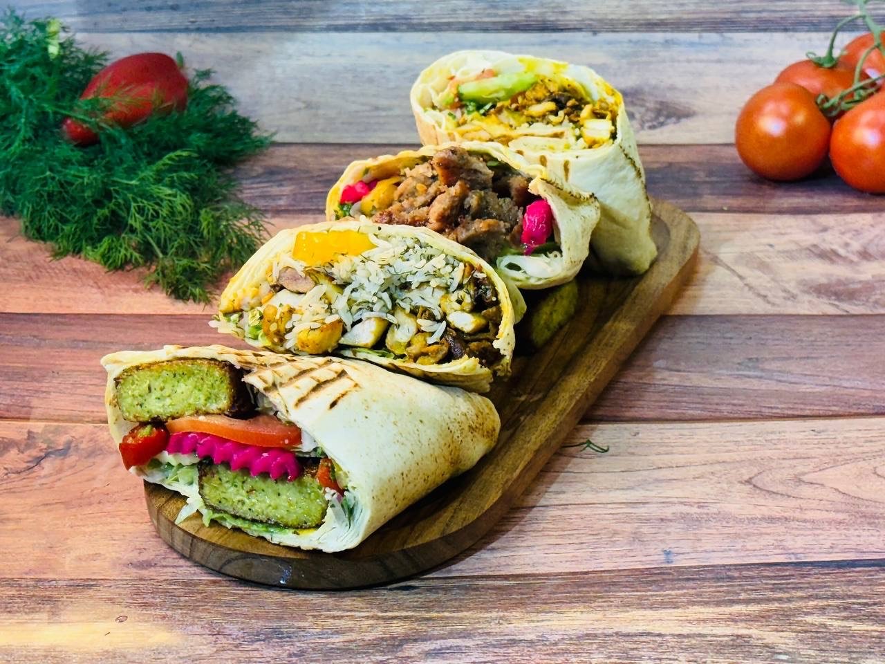 A delicious, authentic east coast take out donair with tomato, onion and sauce.