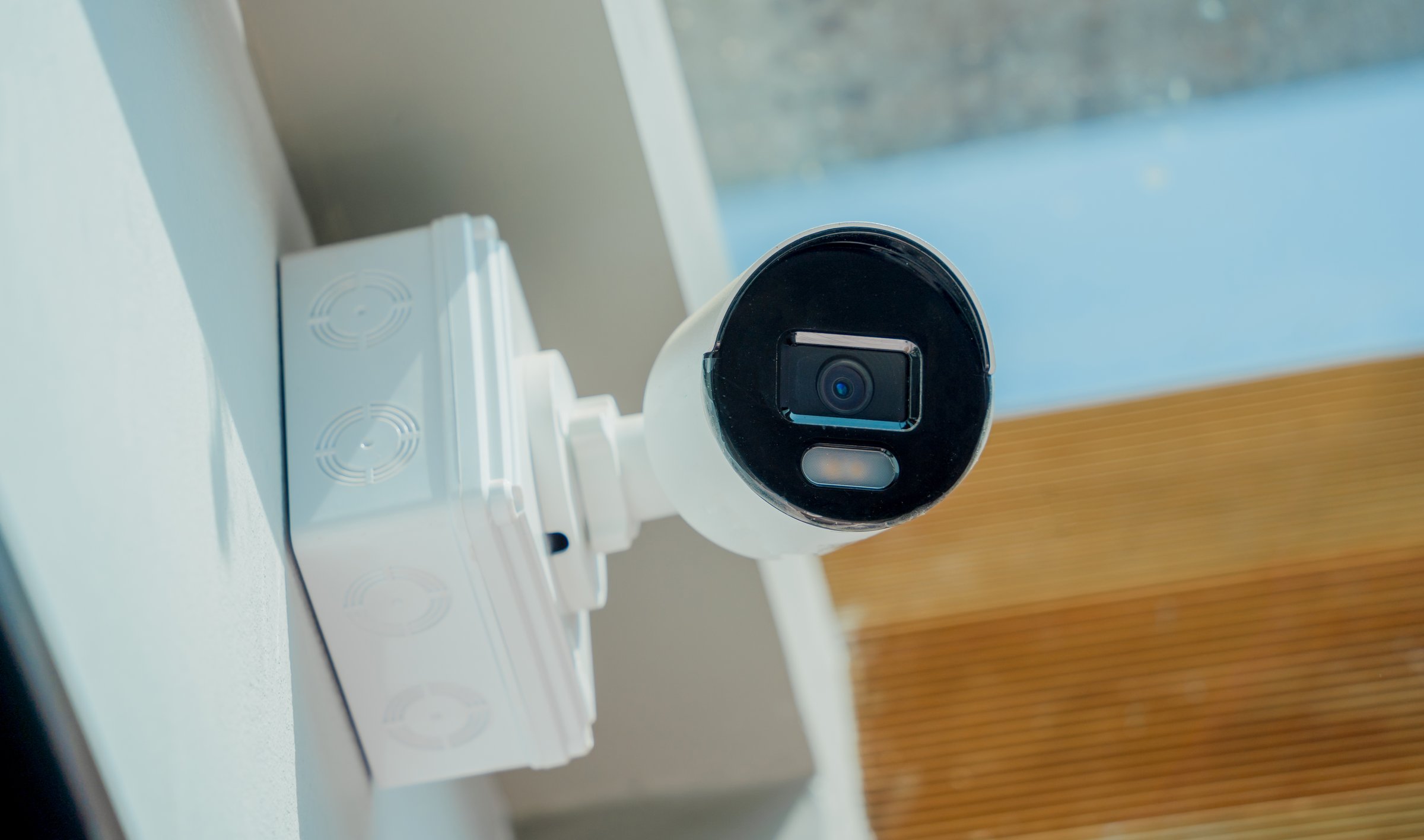 Modern CCTV camera on a wall of a residential building.