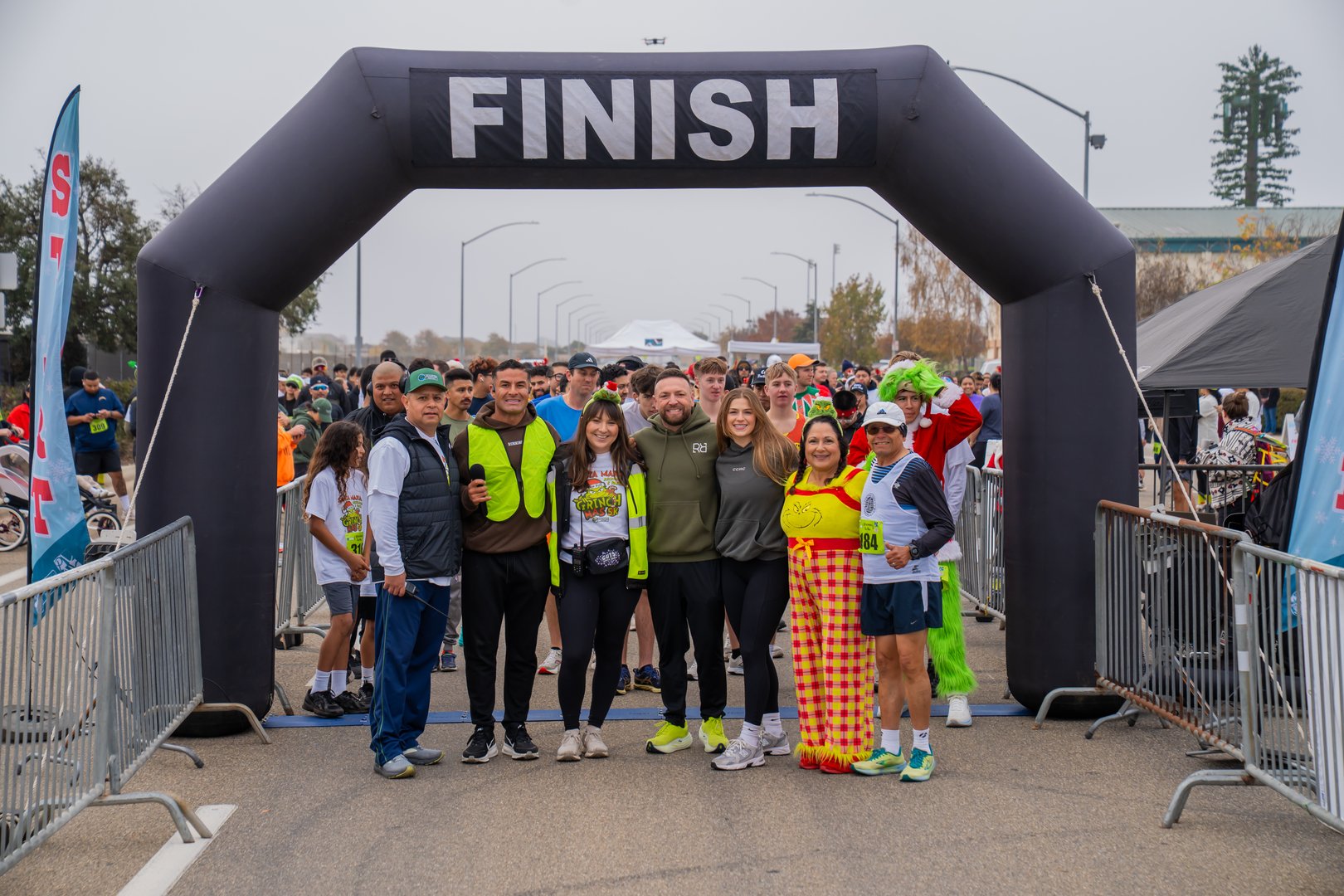 Grinchmas 5K runners celebrating at the finish line