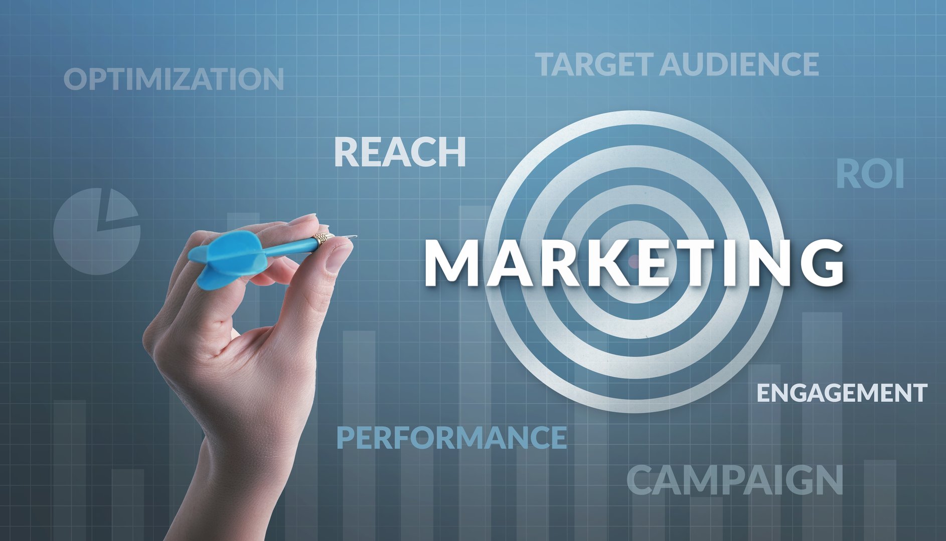 Hand aiming at a target labeled 'Marketing,' surrounded by words like target audience, reach, campaign, ROI, performance, and optimization, symbolizing strategic and precise marketing efforts