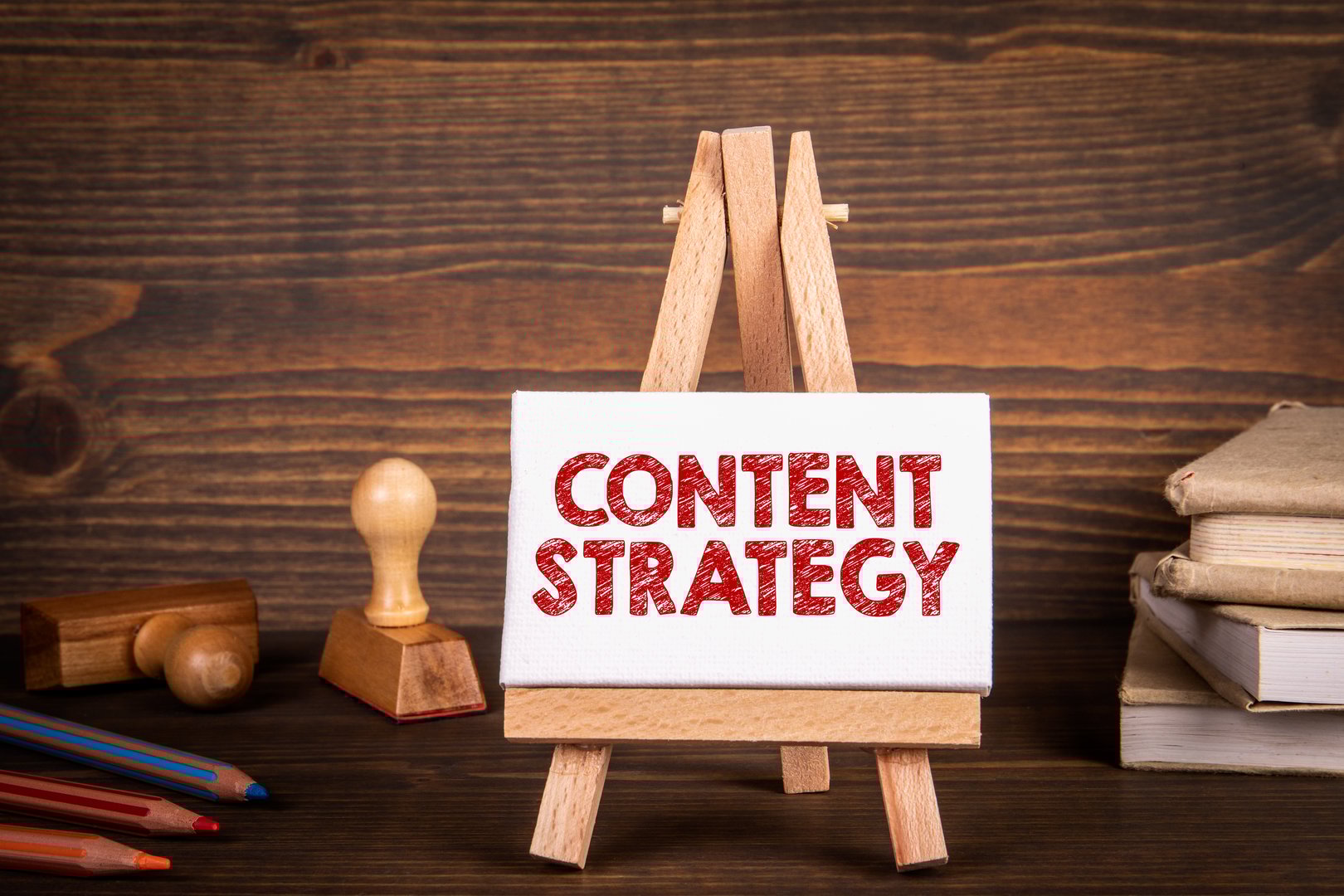 Content Strategy concept. Miniature easel on office desk.