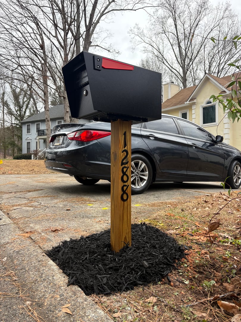 Professional mailbox with decorative stonework installation