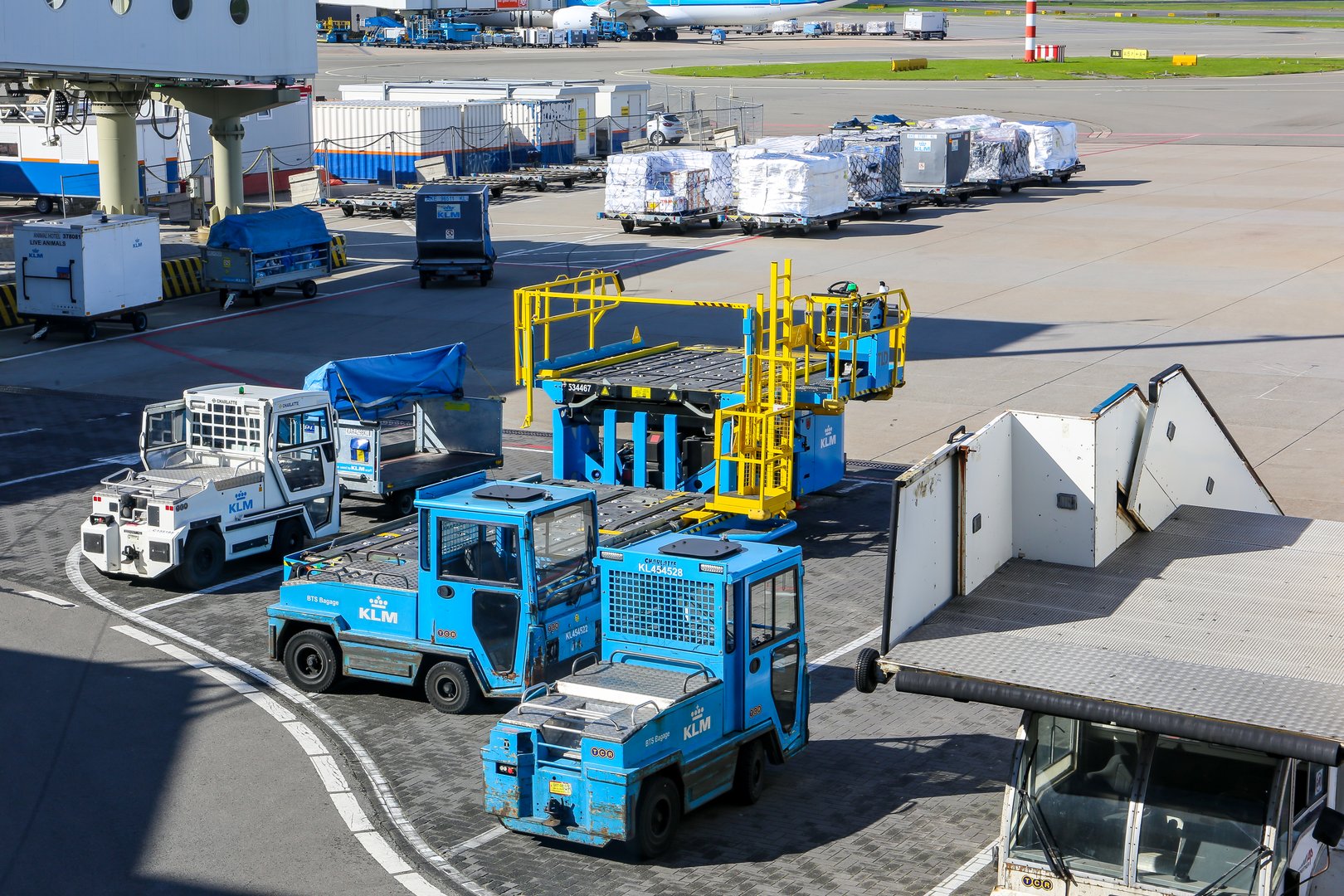 Amsterdam Airport ground handling support equipment vehicles tugs stairs dollies for cargo pallets