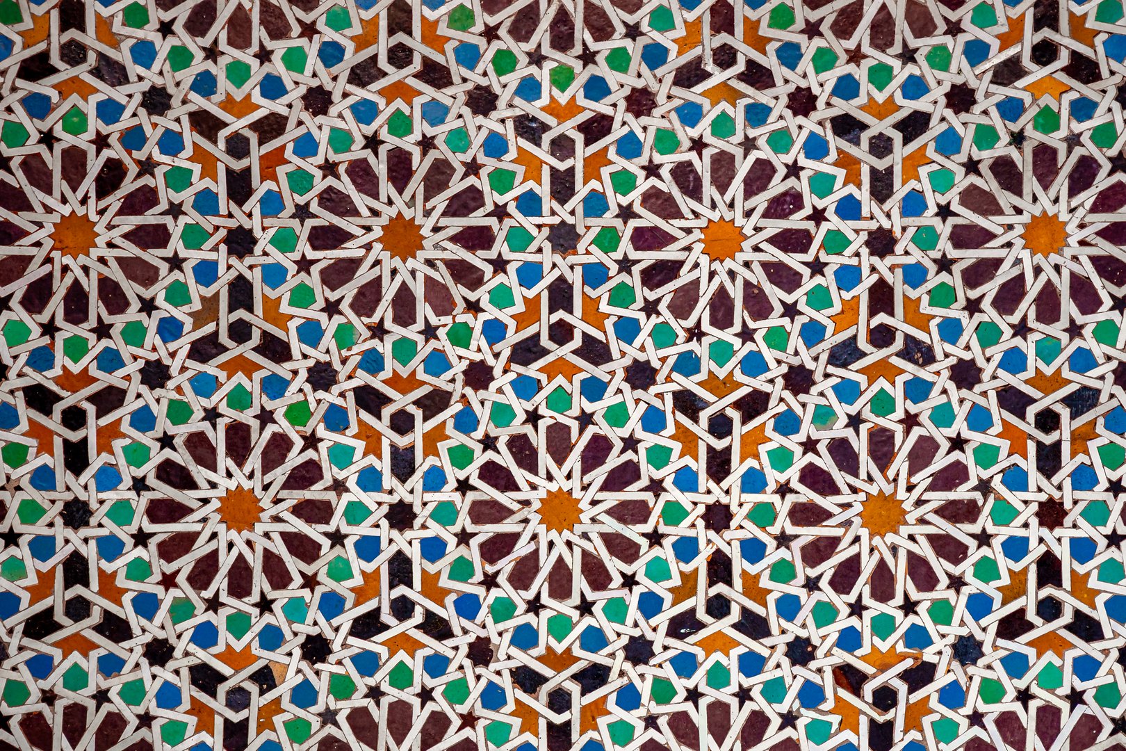 Colorful traditional zellige mosaic in Marrakesh, Morocco, captures the artistry of Islamic geometric design with intricate hand-cut tiles reflecting ancient craftsmanship and cultural heritage.