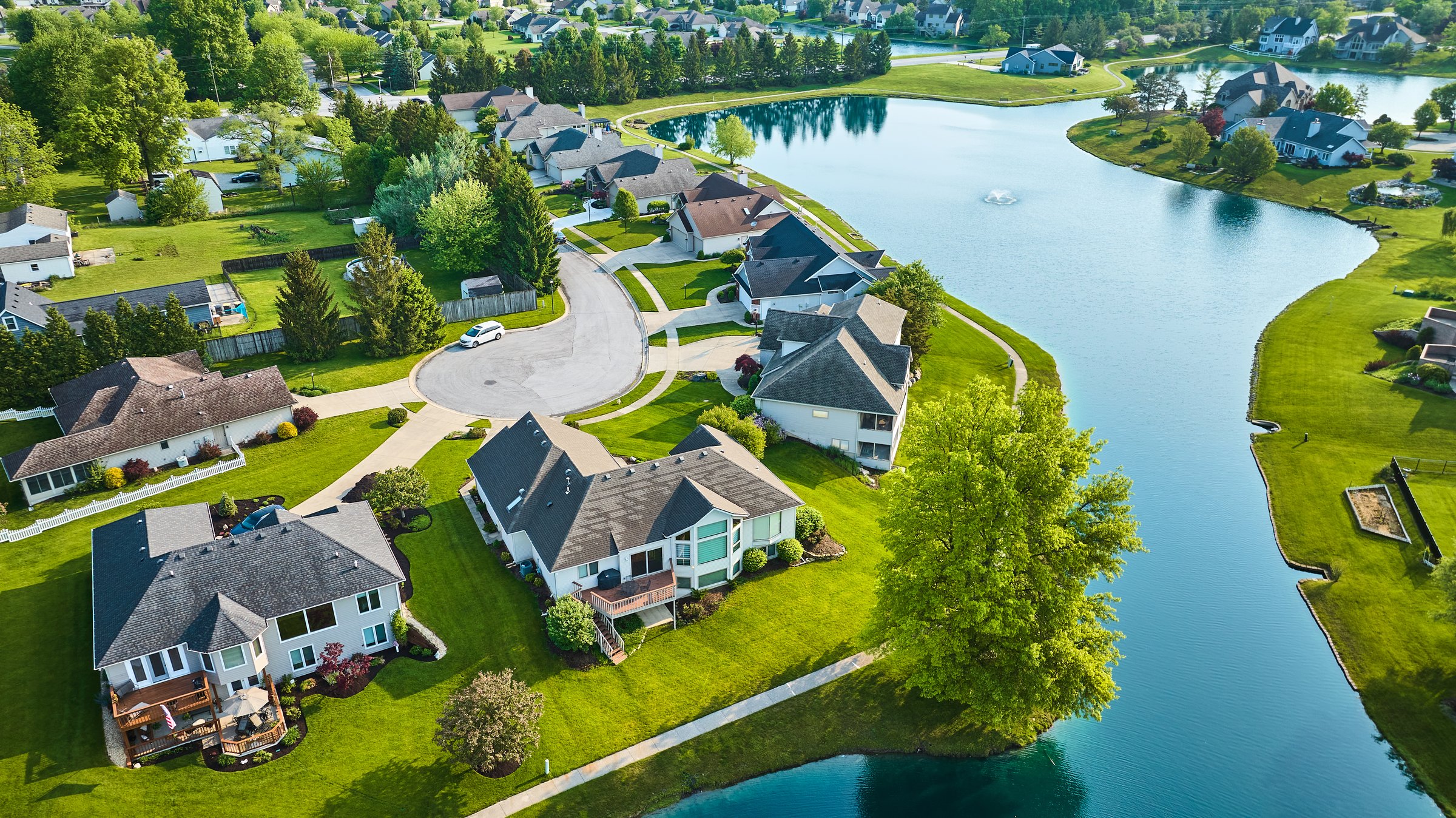 Houses next to large pond