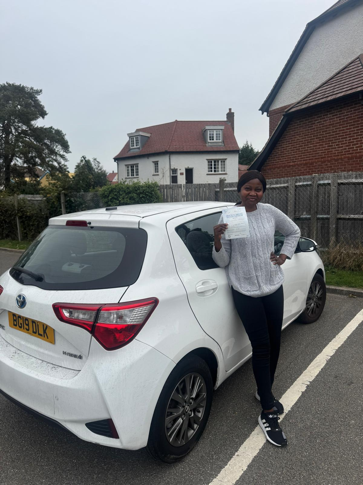 Successful driving test student with pass certificate