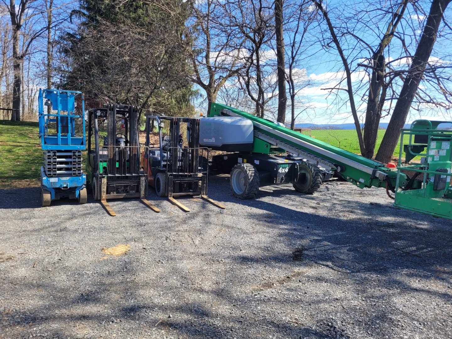 Row of well-maintained refurbished excavators from Hibner Sales