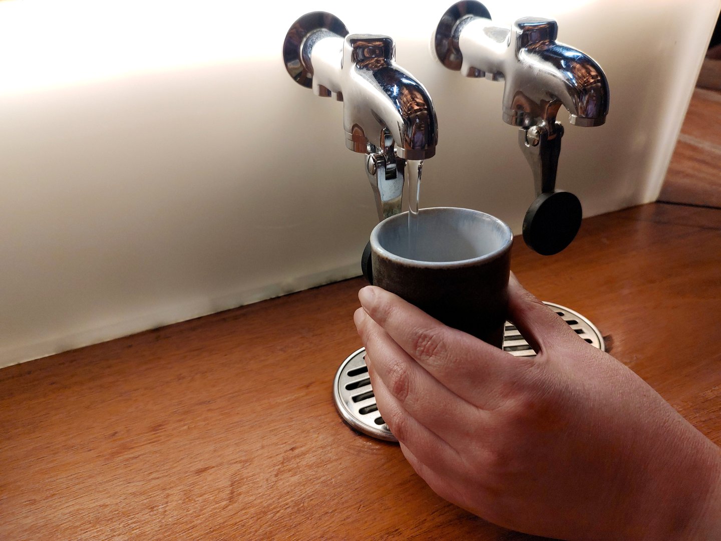 Hot water dispenser for brewing tea in a glass on a Japanese-style