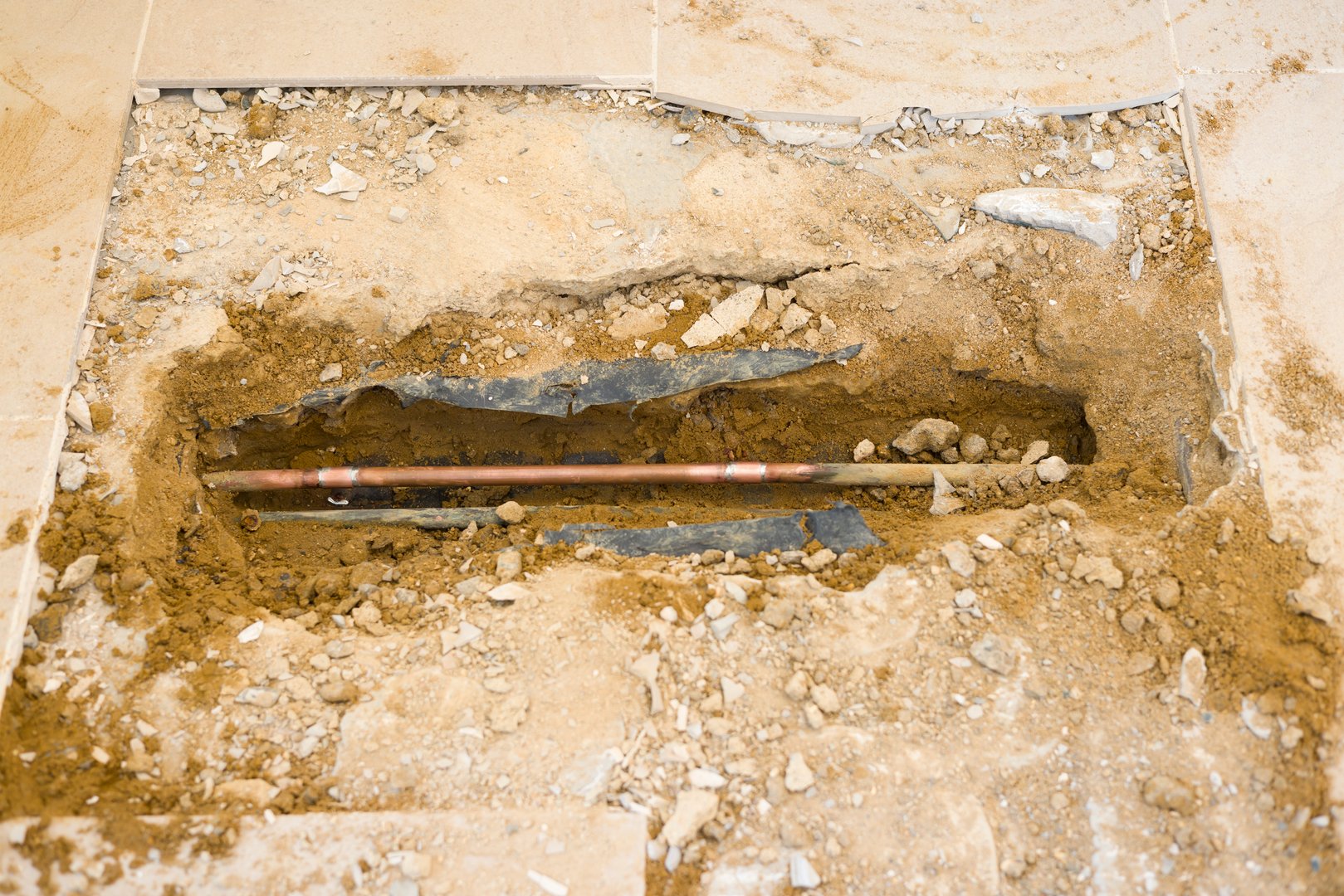 Slab leak repair under floor