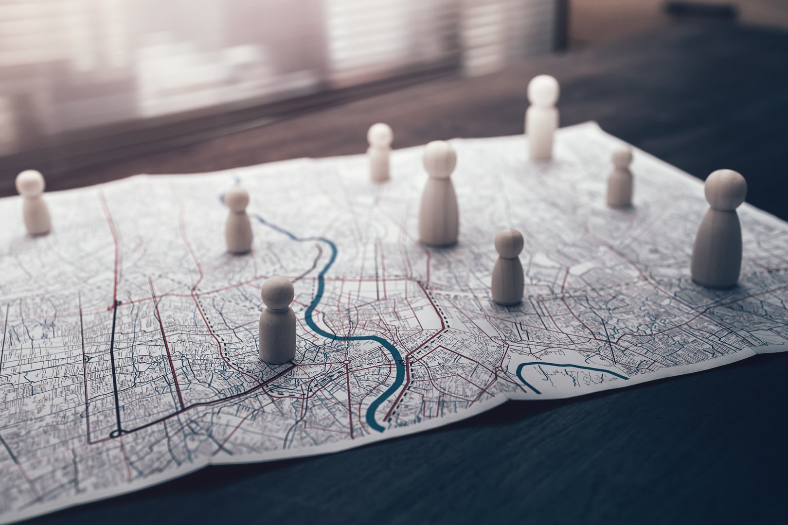 The wooden doll represents the employee of the company on route map represents networking, connection. Corporation, Enterprise concept.