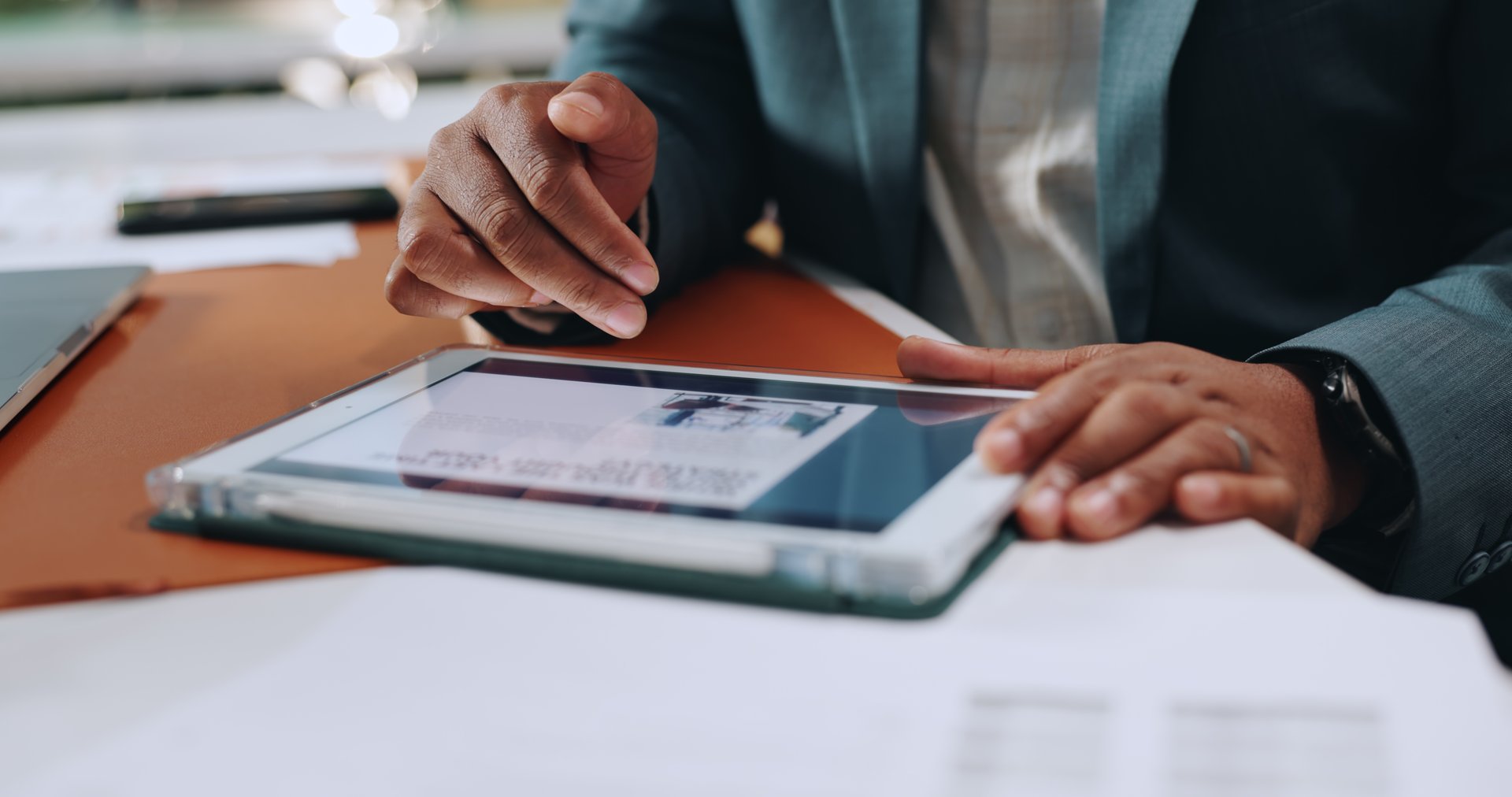 Businessman, hands and tablet with website, article and research for strategy and corporate news in office. Digital tech, project planning and scroll online for reading information, growth with media