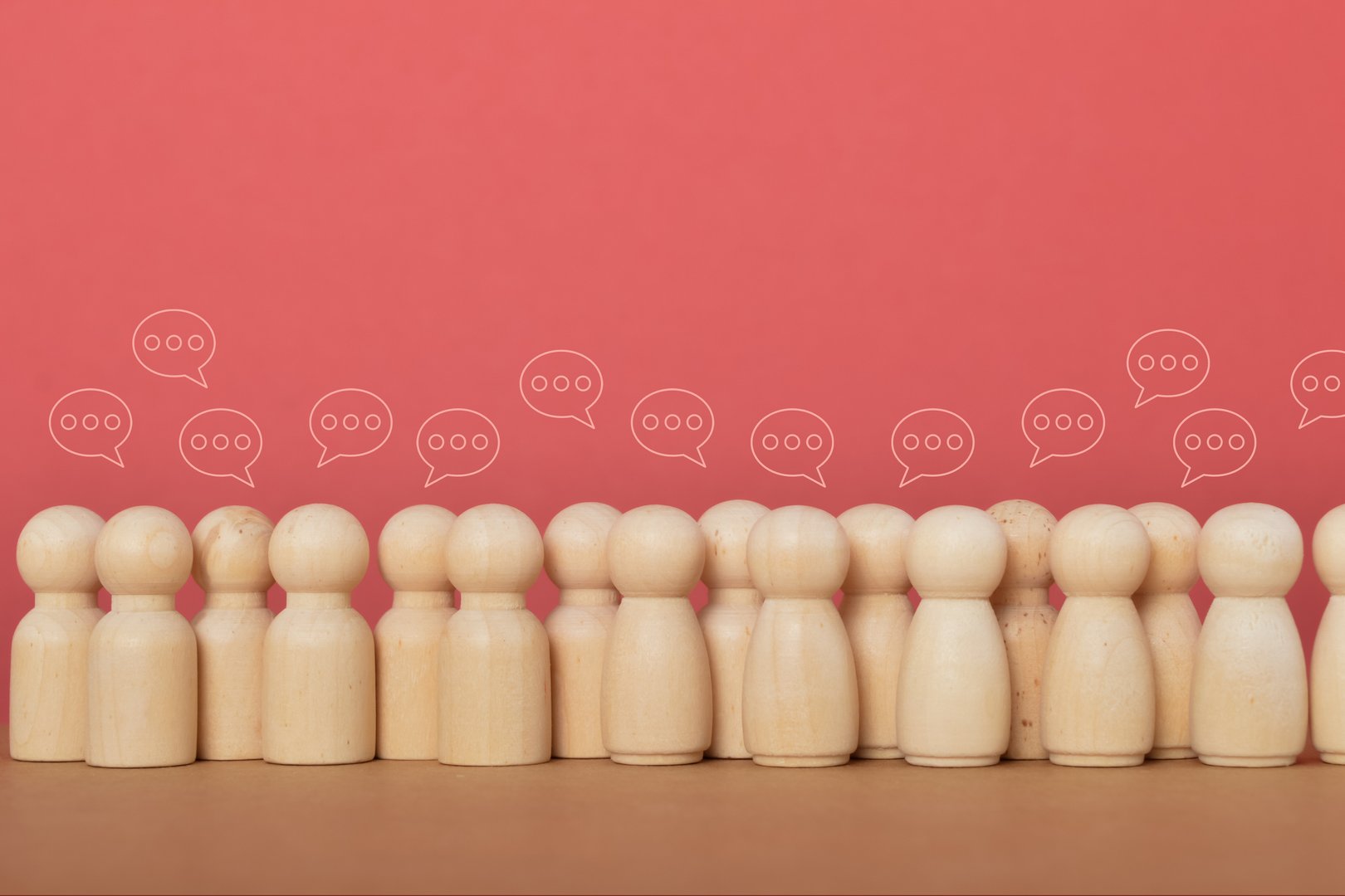 A crowd of individuals with an icon of chatting, symbolizing the significance of social media and the interconnectedness of people in the modern world.