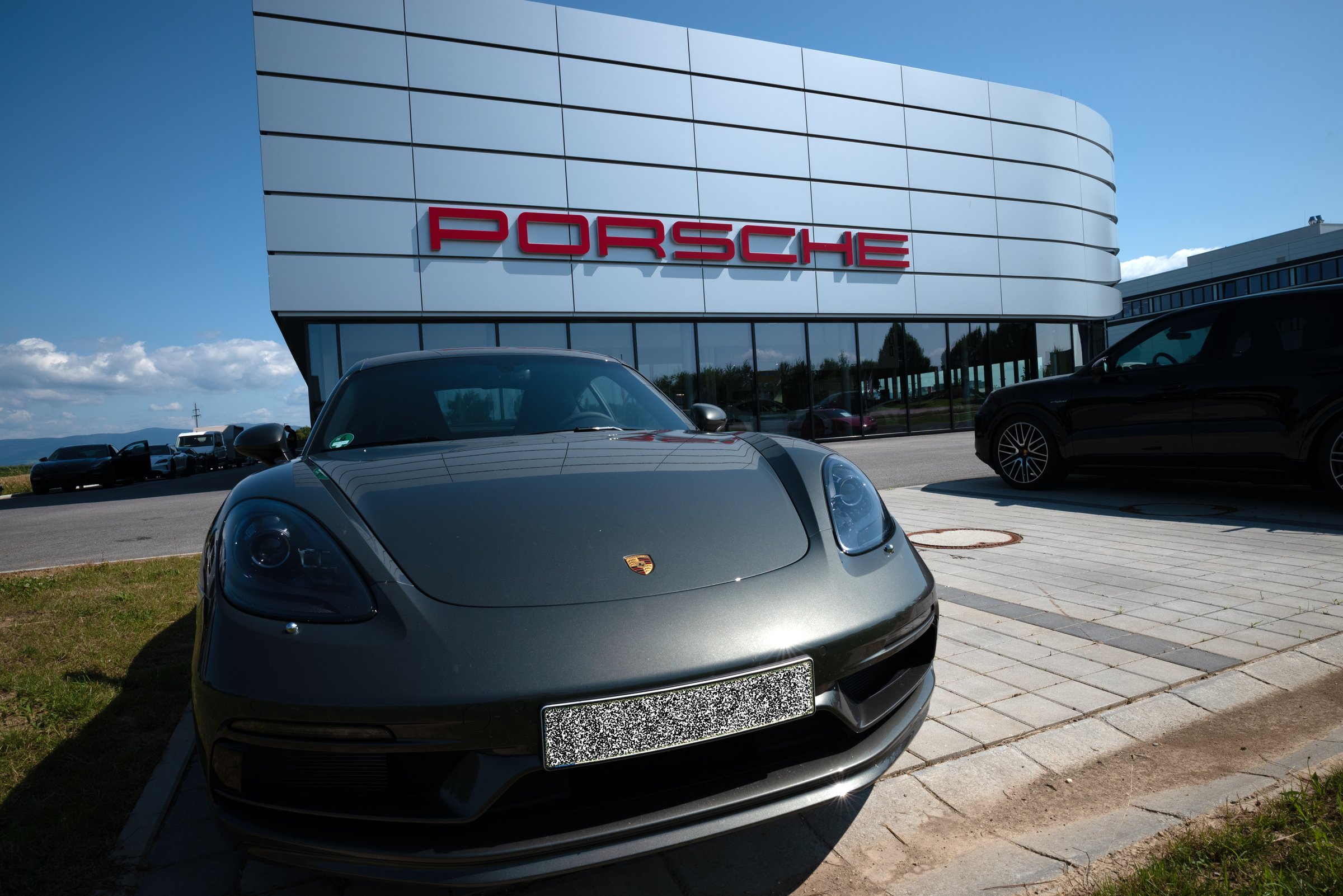 Plattling, Lower Bavaria, Germany, 2024, a Porsche car parked in front of a dealer