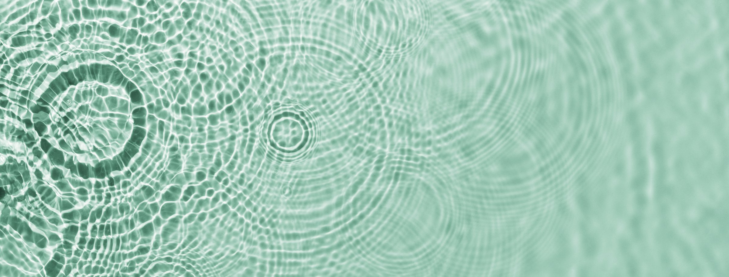 Water ripples on green background. Abstract water ripples texture.