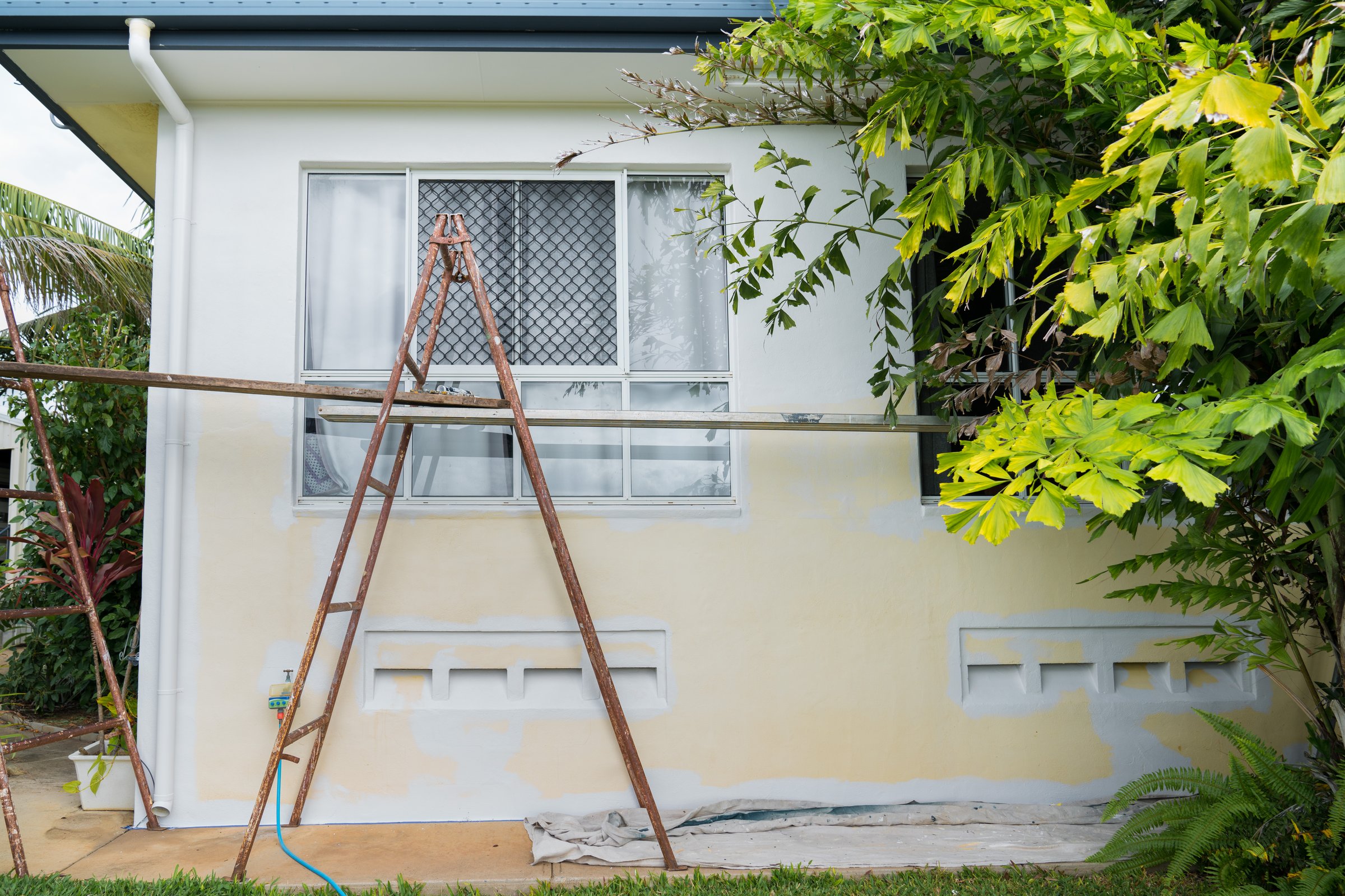 Scaffolding set up to paint house exterior