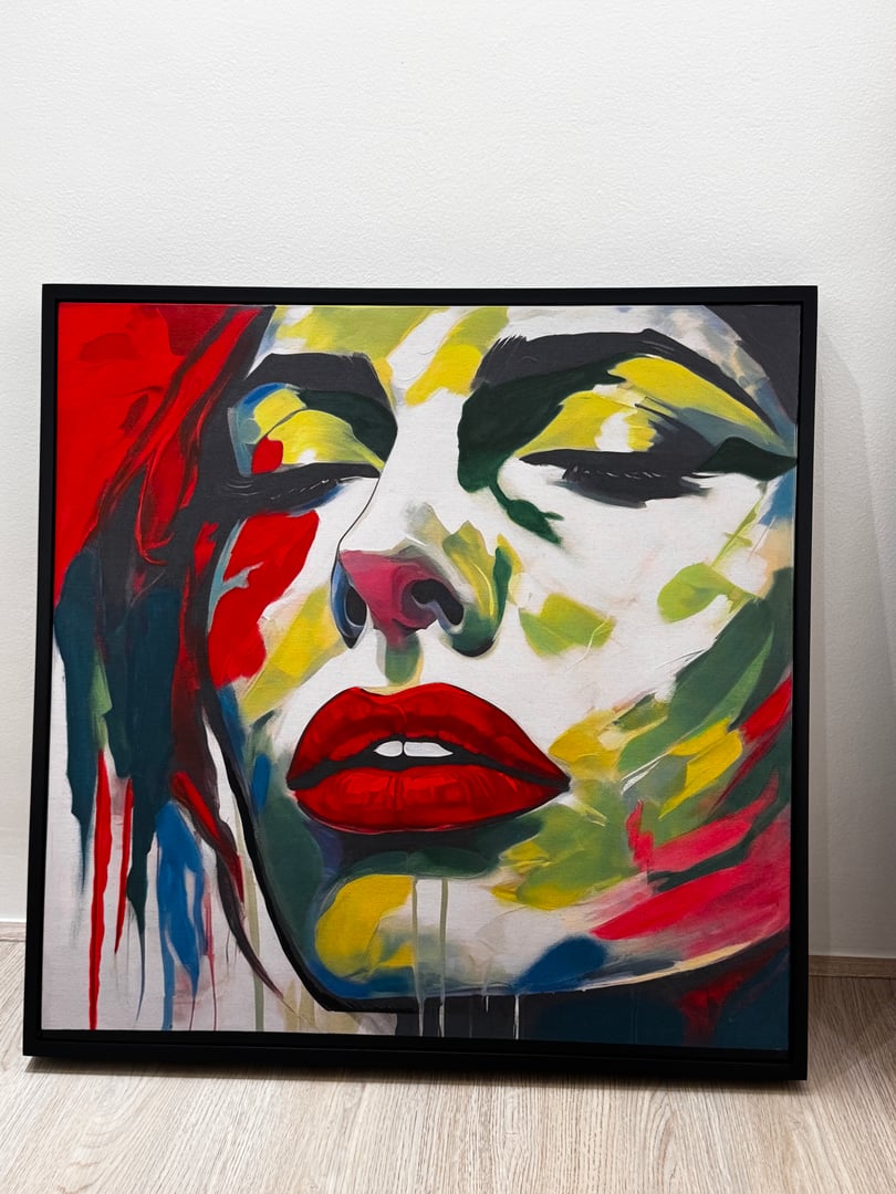 Abstract painting of a womans face with vivid colors and red lips, featuring bold brushstrokes and a contemporary style.