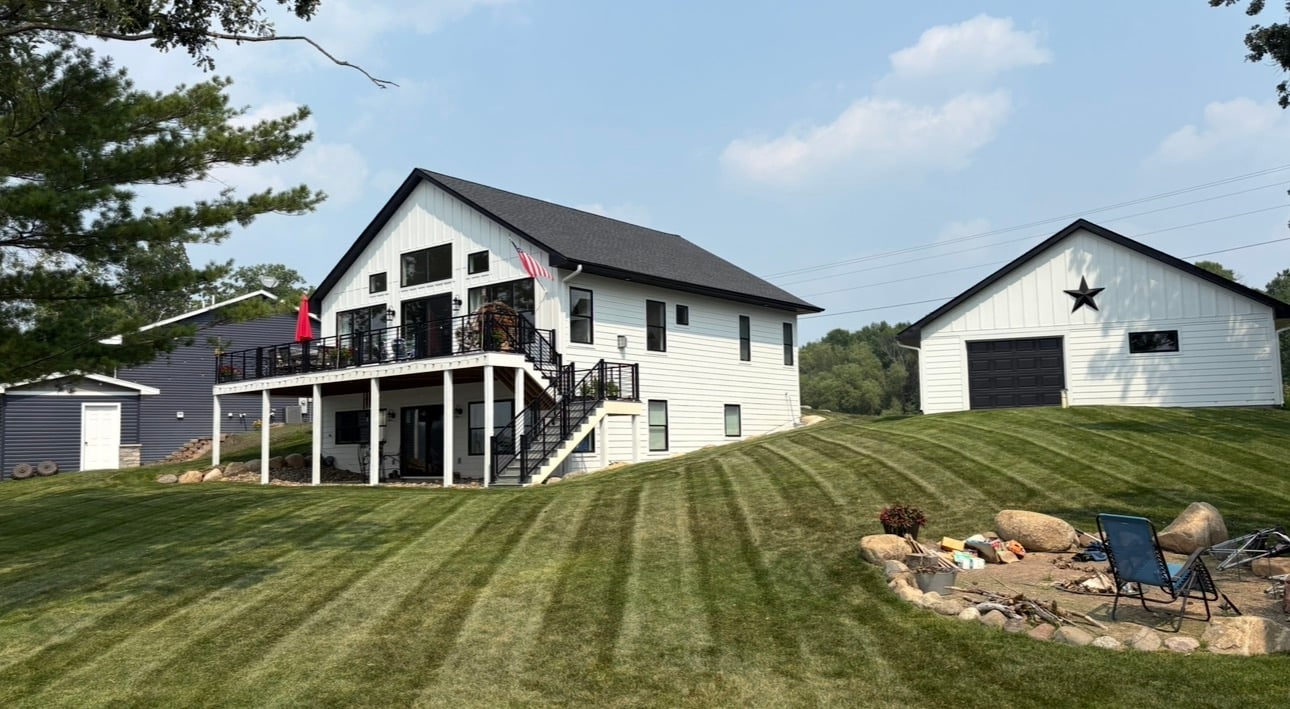 Beautiful landscaped lawn by Lee's Outdoor Services