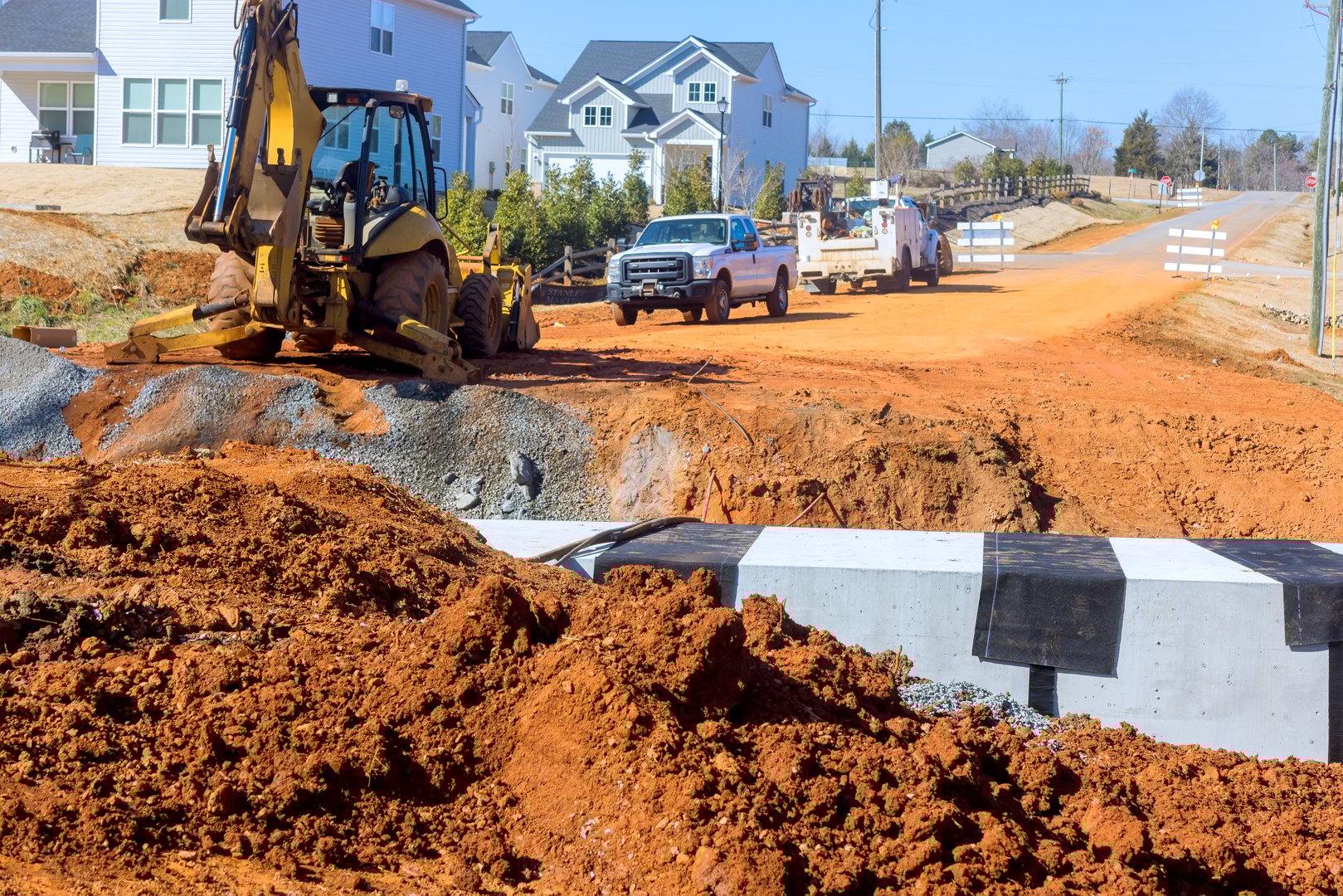Heavy machinery operates on rural road