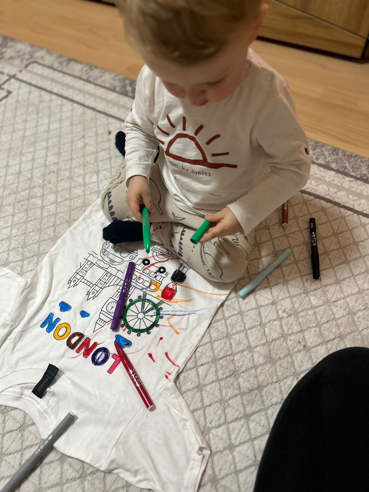 Roel focused on colouring his T-shirt design