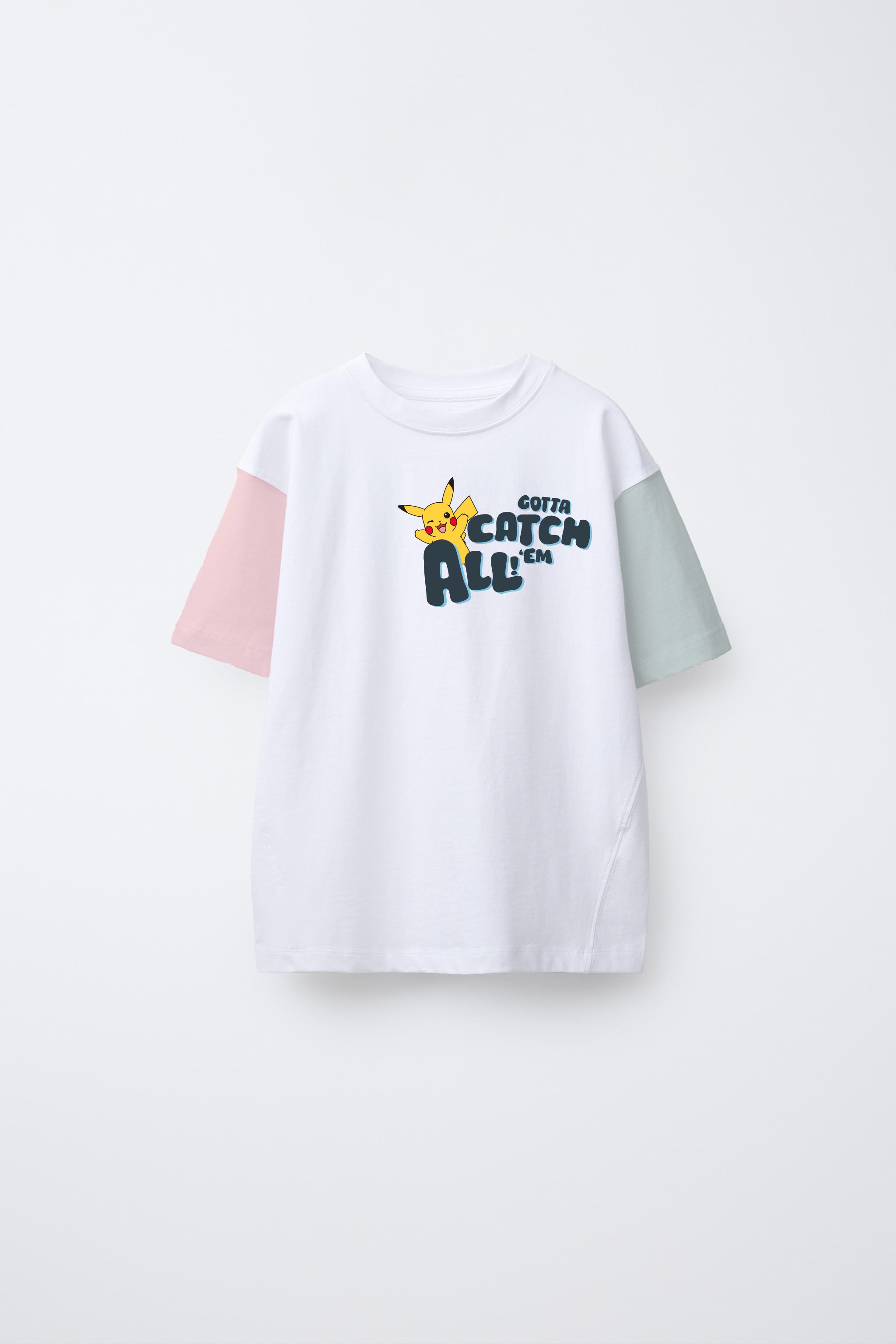 White T-shirt with "Gotta Catch 'Em All" text and Pikachu graphic. Sleeves are pink and mint green.