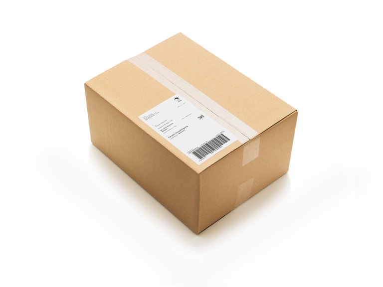 A cardboard shipping box with a white label and barcode on a white background.