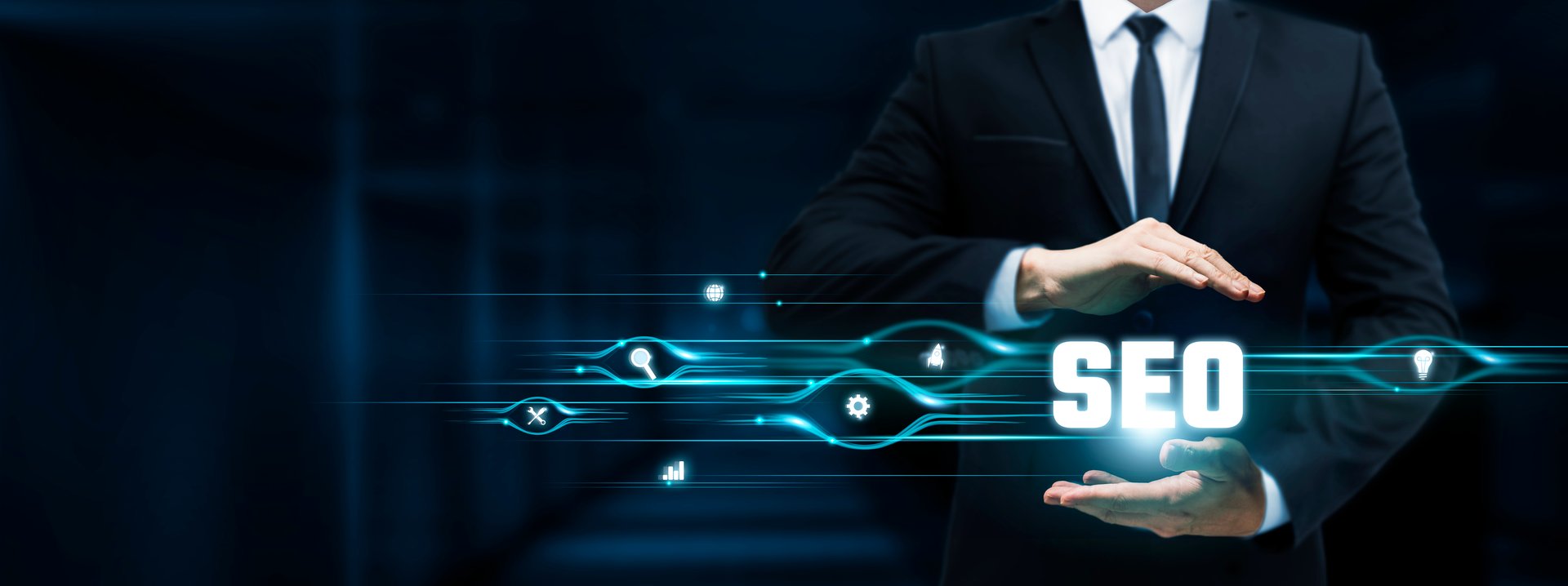 SEO, Businessman Holding Search Engine Optimization (SEO) icon, Digital Marketing, Keywords, Analytics on Dark Background.