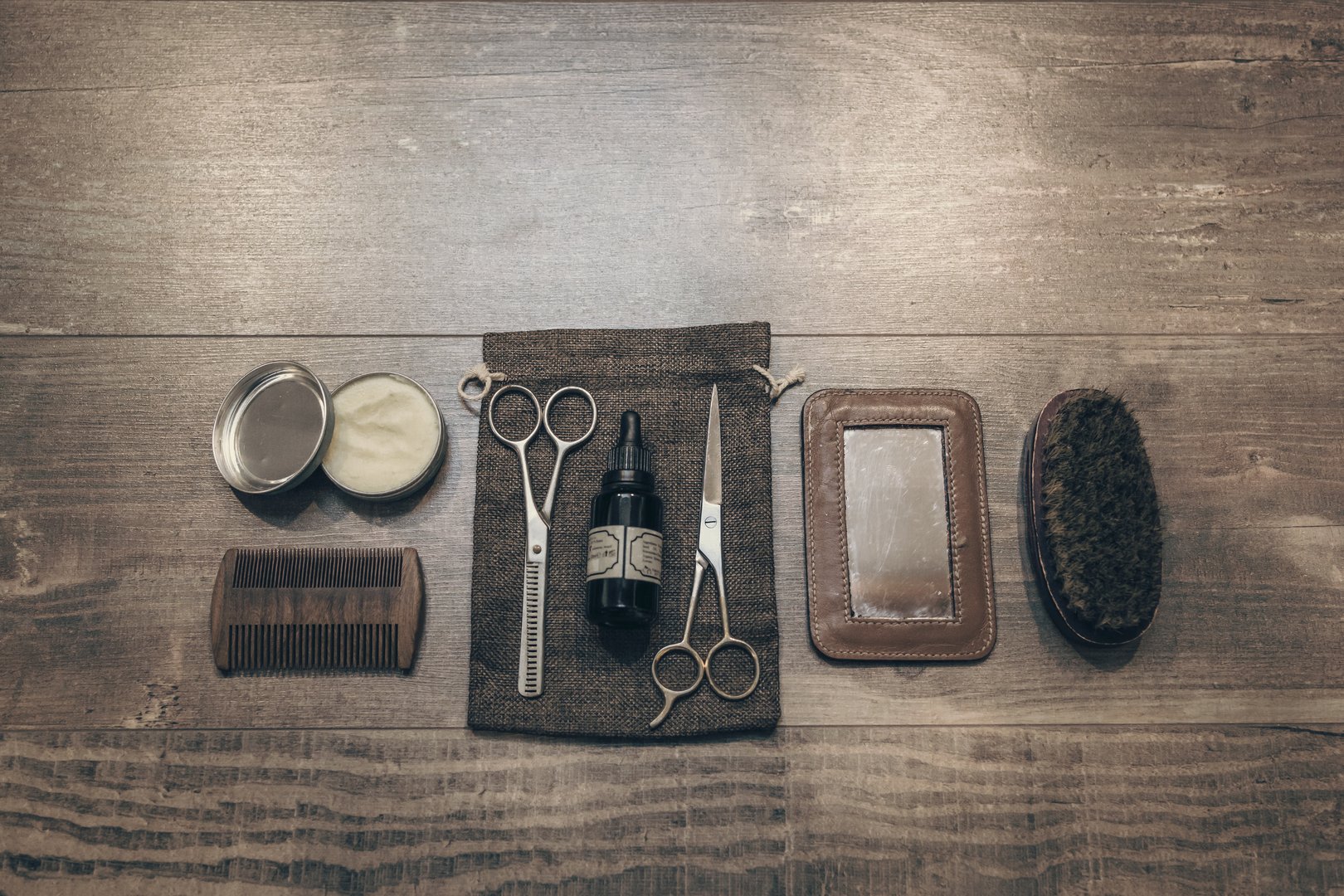 Vintage barber equipment on wood desk with place for text