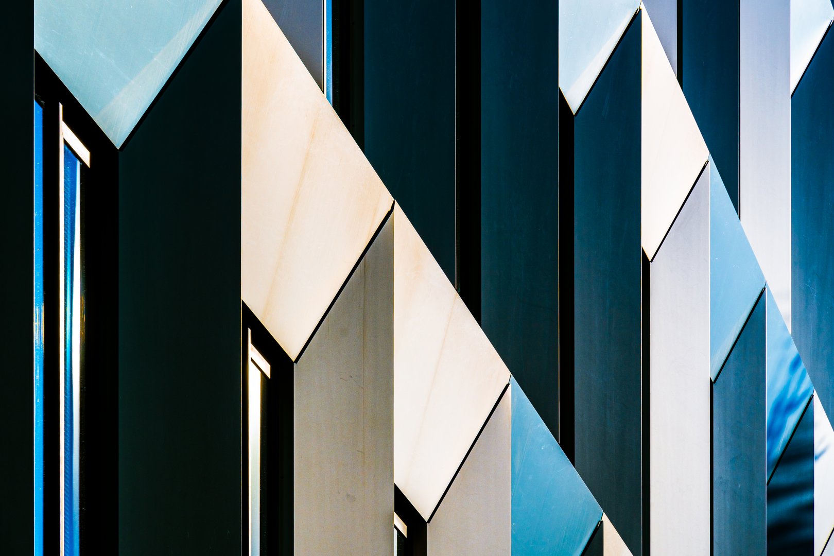 Abstract Colorful Architectural Facade with Interplay of Light, Shadows, and Angular Geometric Patterns