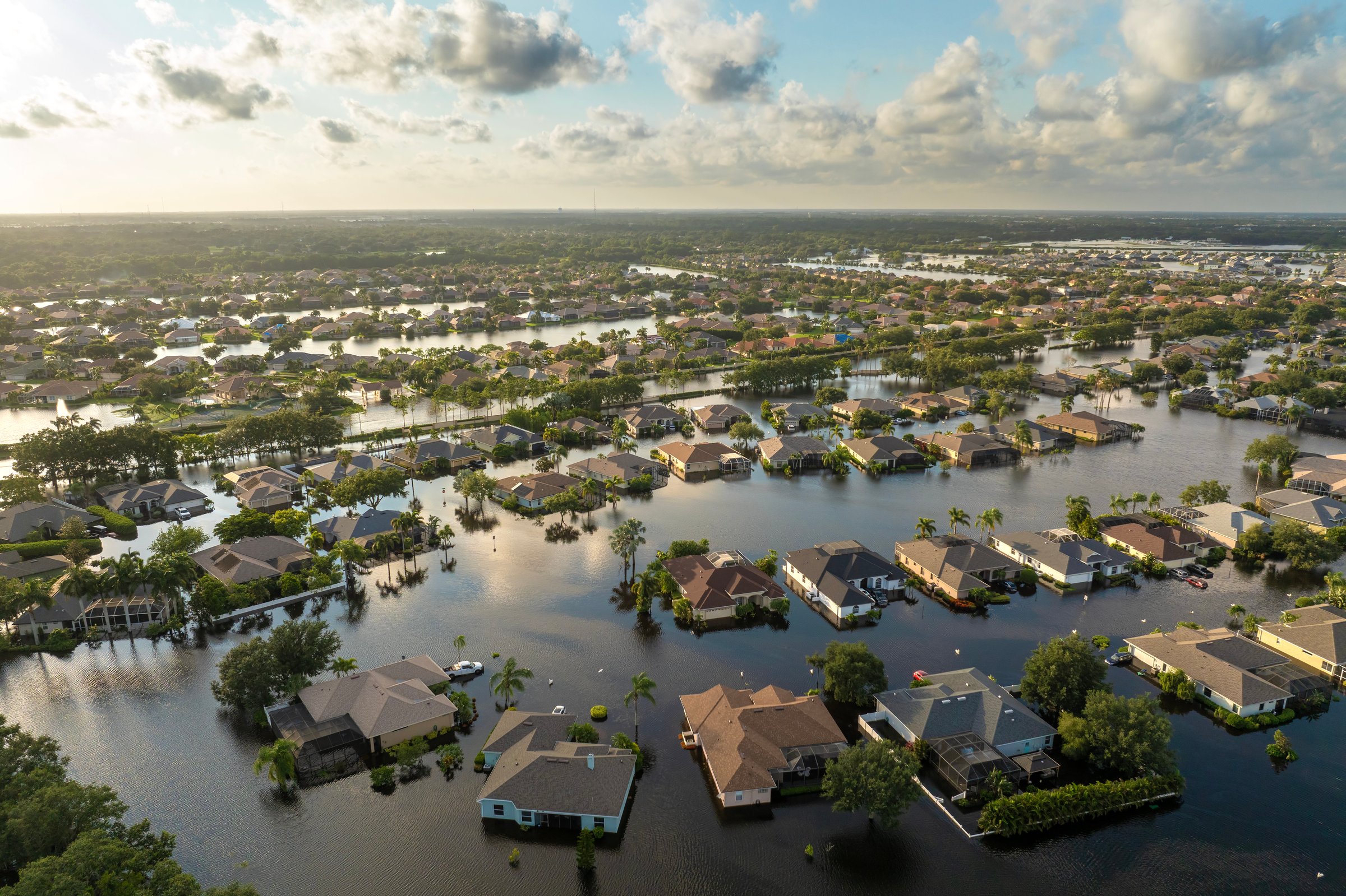 Flooding in Florida caused by tropical storm from hurricane Debby. Suburb houses in Laurel Meadows residential community surrounded by flood waters in Sarasota. Aftermath of natural disaster.