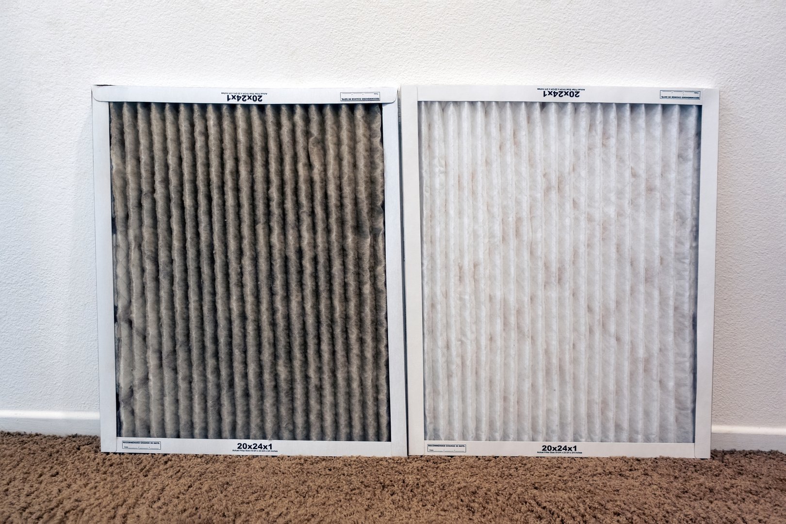 Dirty HVAC air filter compared to clean filter showing need for maintenance