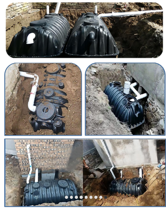 Installation process of black underground septic tanks with connecting white pipes in a residential setting.