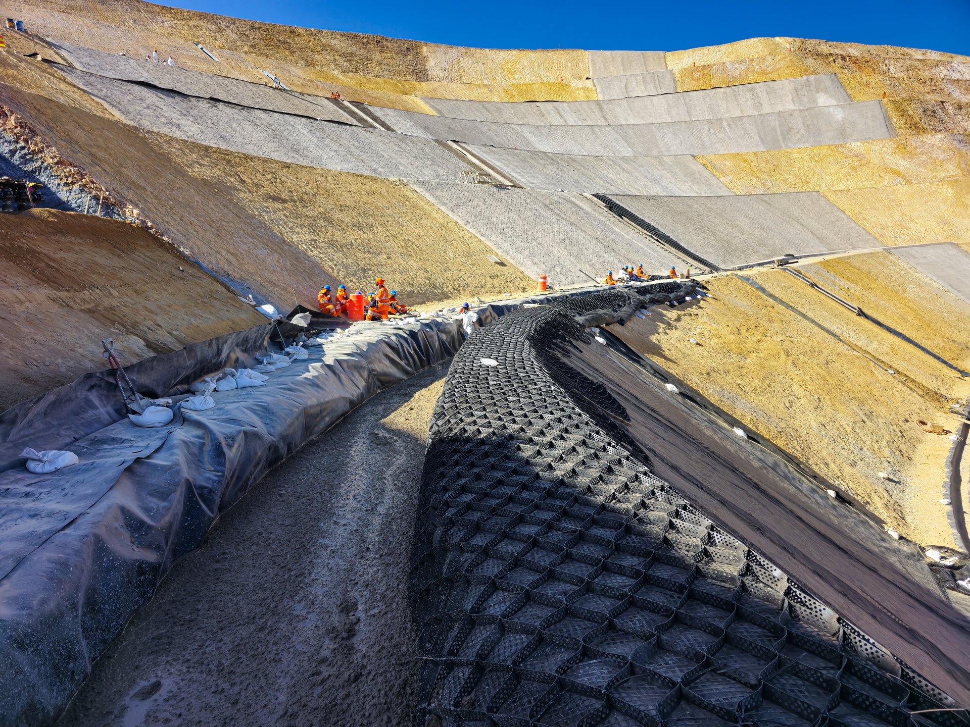 Slope stabilization with shotcrete and geosynthetic materials