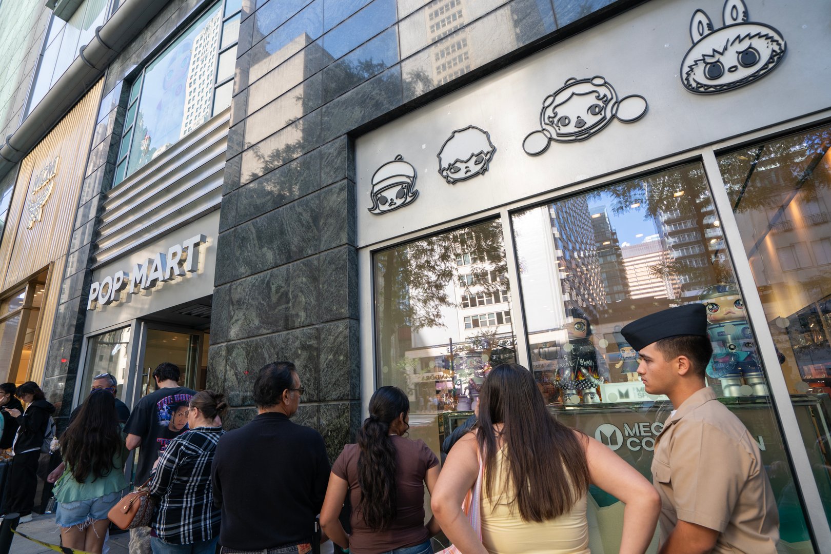 Customers waiting in line to enter a POP MART store in Chicago, Illinois. Pop Mart is a Chinese character-based entertainment company known for its designer toys.