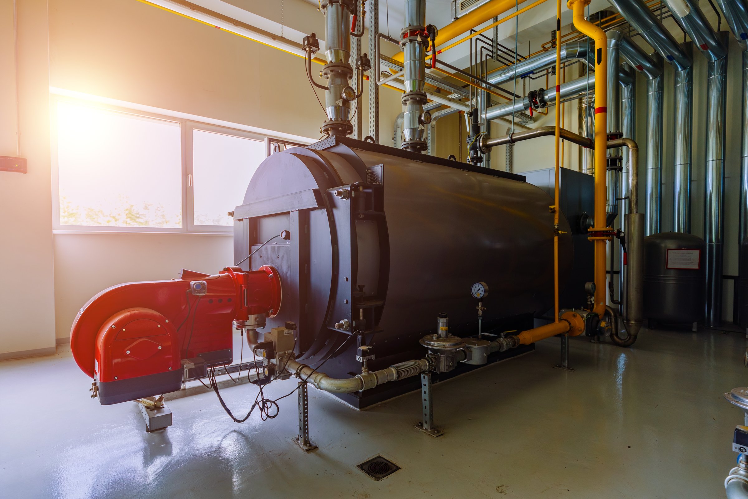 Industrial boiler room with modern boiler equipment.