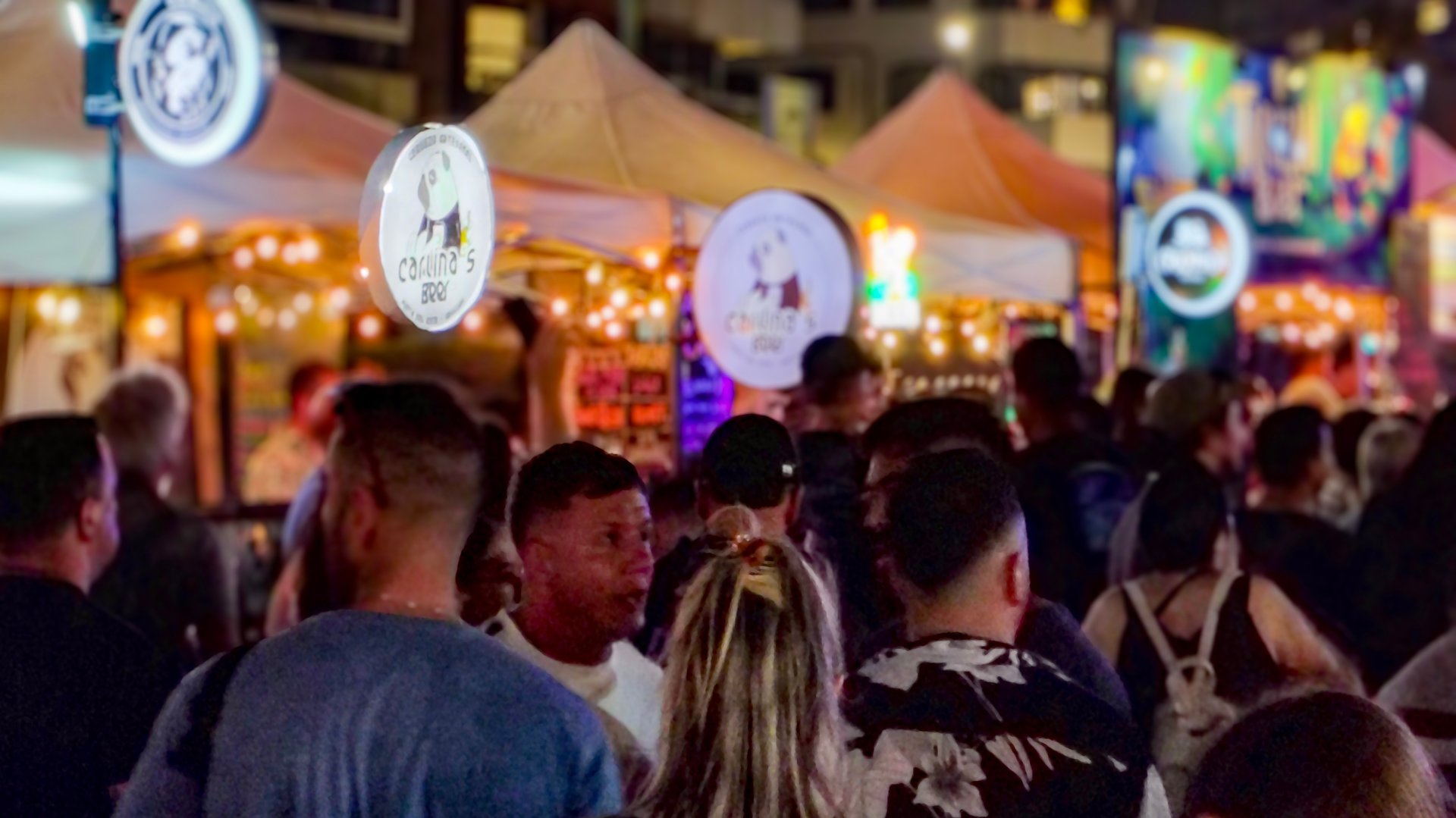 Punta del este, Uruguay: January 12 2025: Crowd at summer night music festival event, with food trucks wiht foods and craft beer products, punta del este city, maldonado department, uruguay