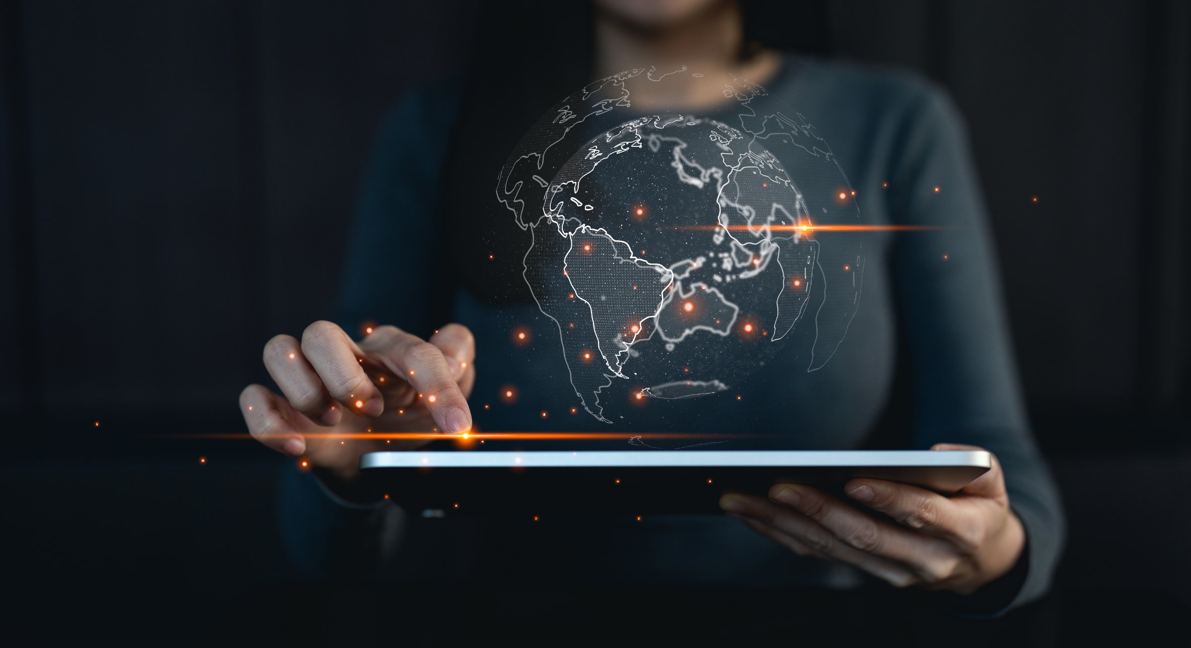 Big data analytics and business intelligence concept. Businessman holding Global network connection. World map point and line composition concept of global business.Digital link tech.