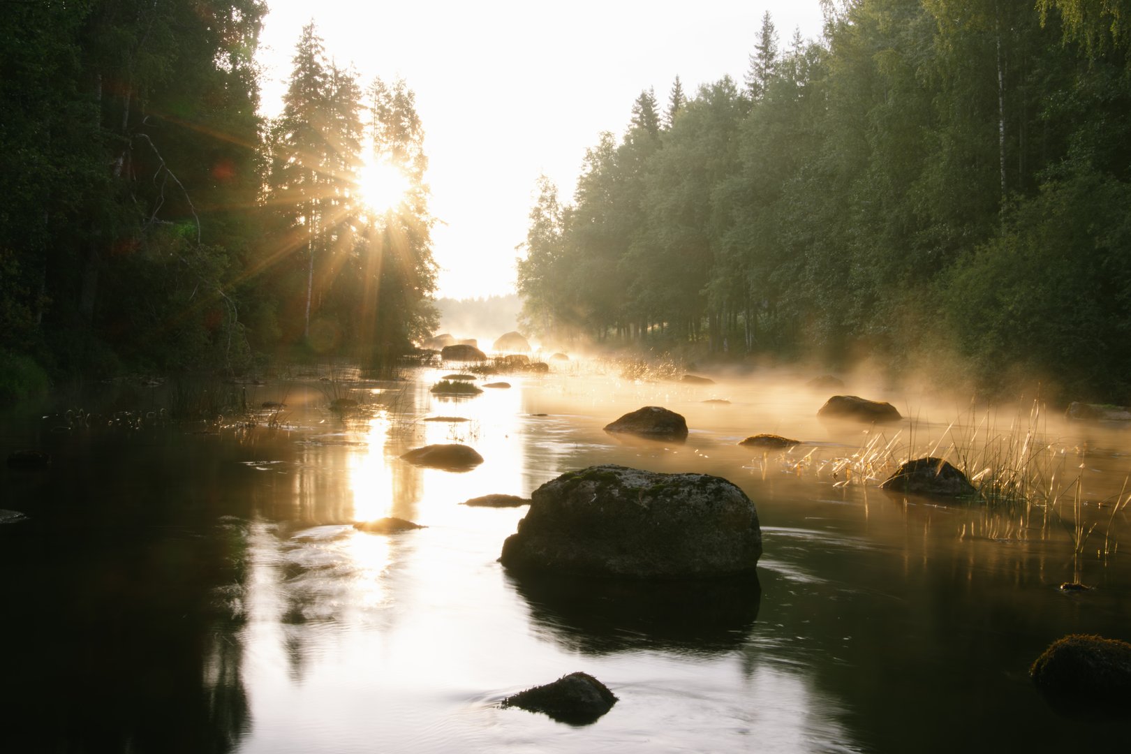 Sunrise on a river in Finland