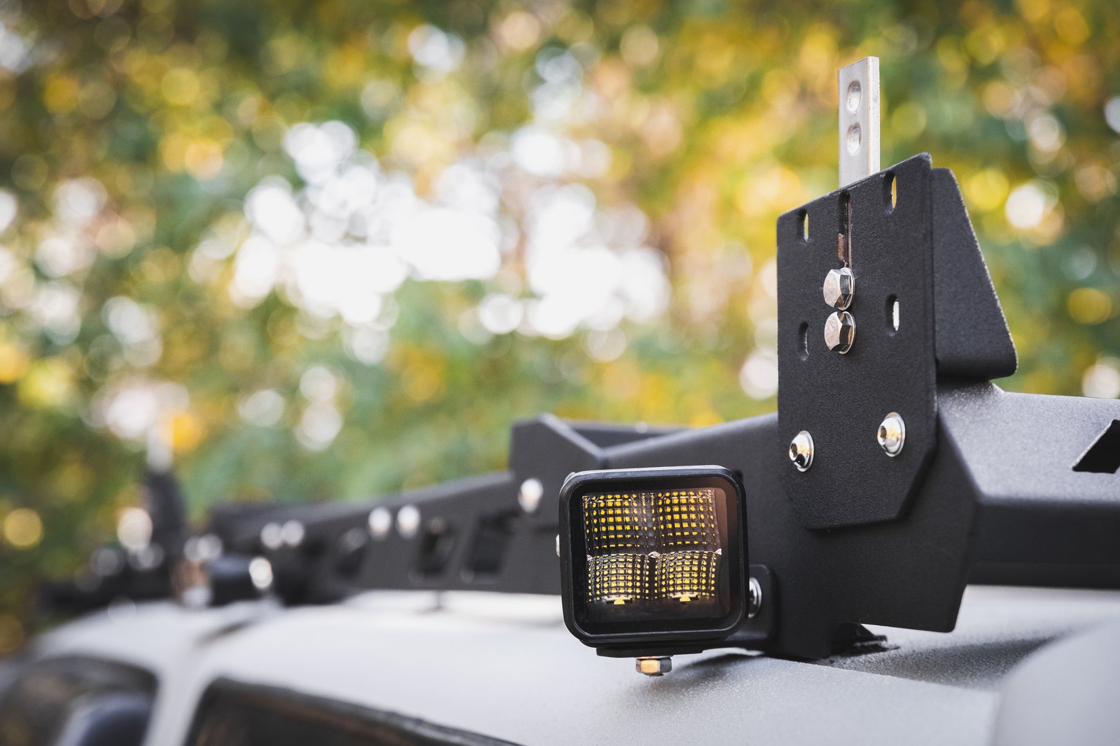 Custom LED side light bar on roof rack off road car, copy space.