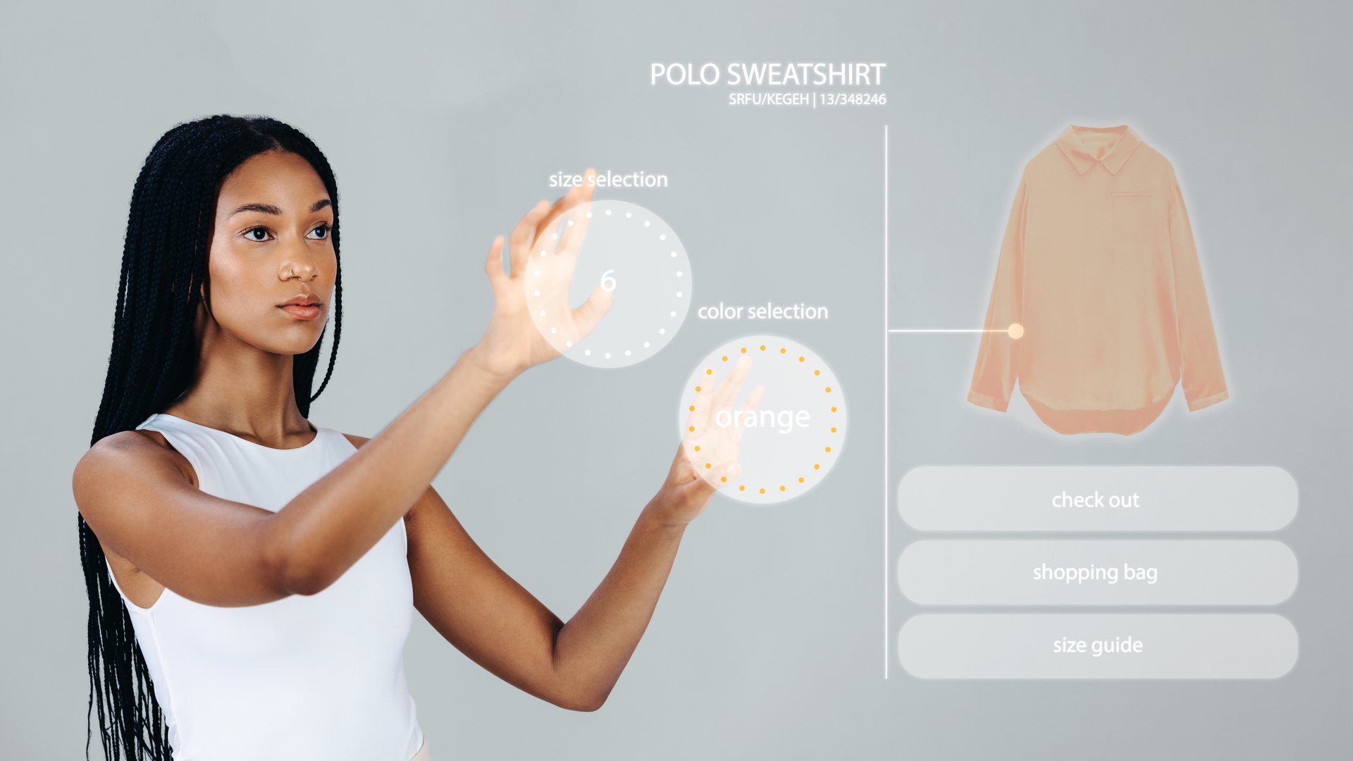 Online shopping in the metaverse. Woman choosing the size and colour of a sweatshirt on a virtual touch screen. Female shopper browsing an online store in digital space.