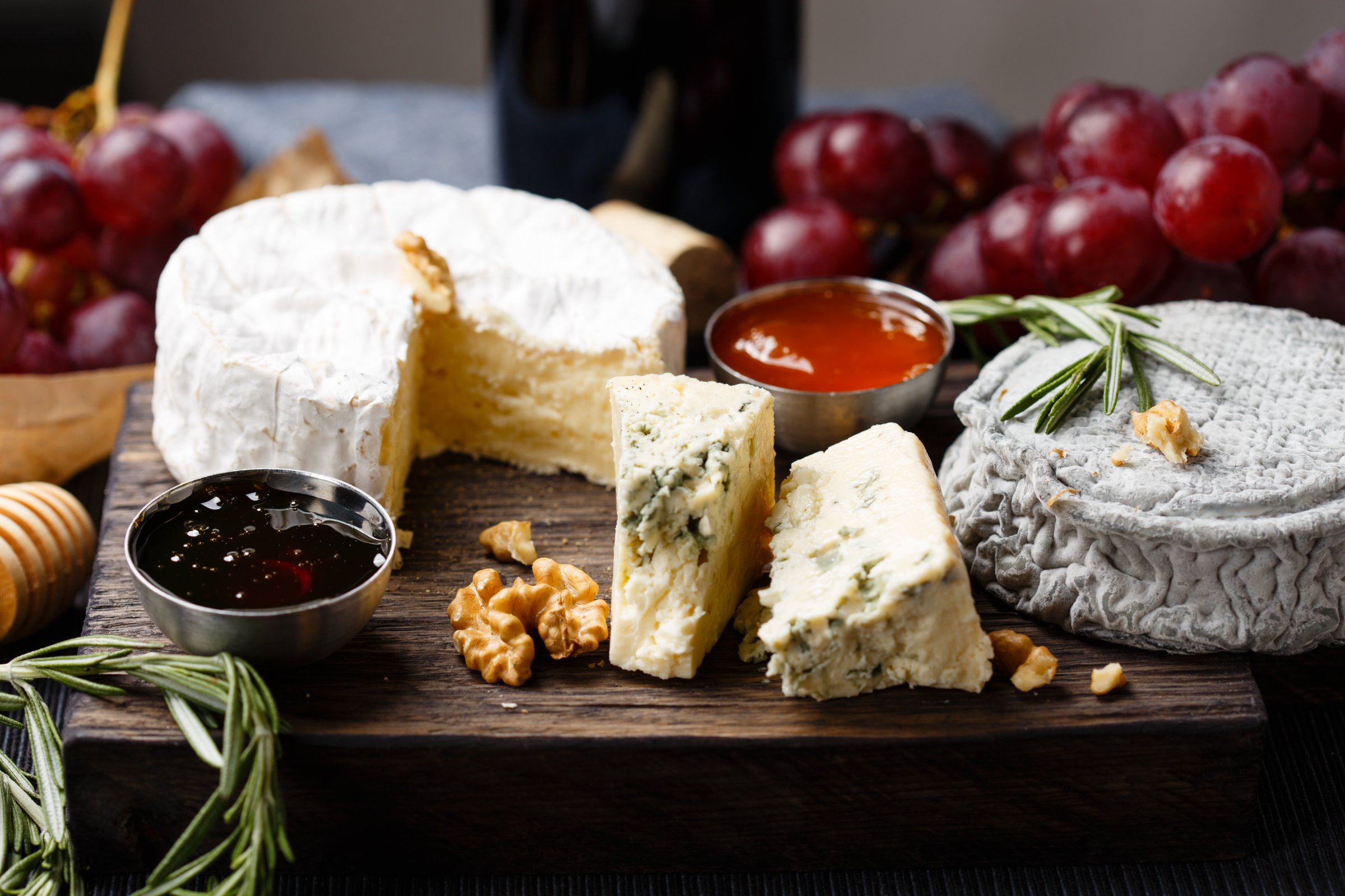 Cheese plate   served with wine, jam and honey close-up